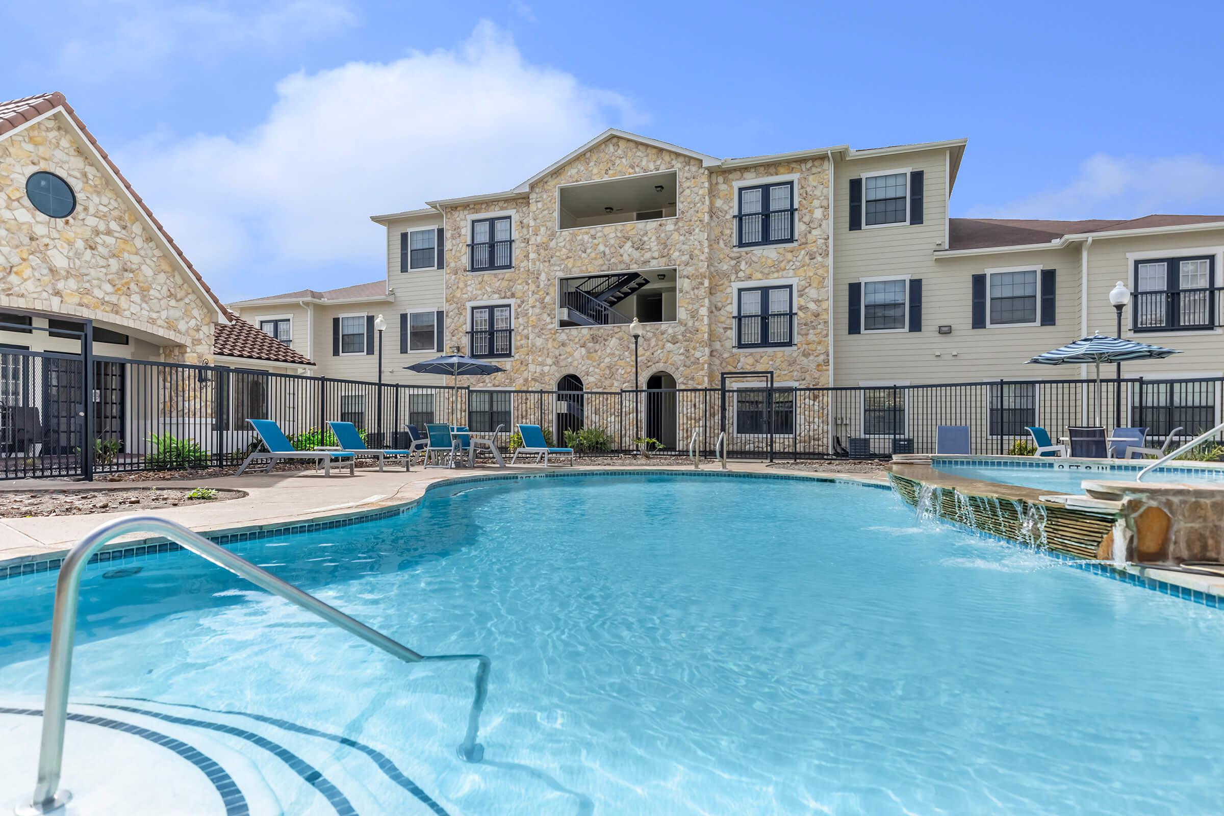 a house with a large pool of water