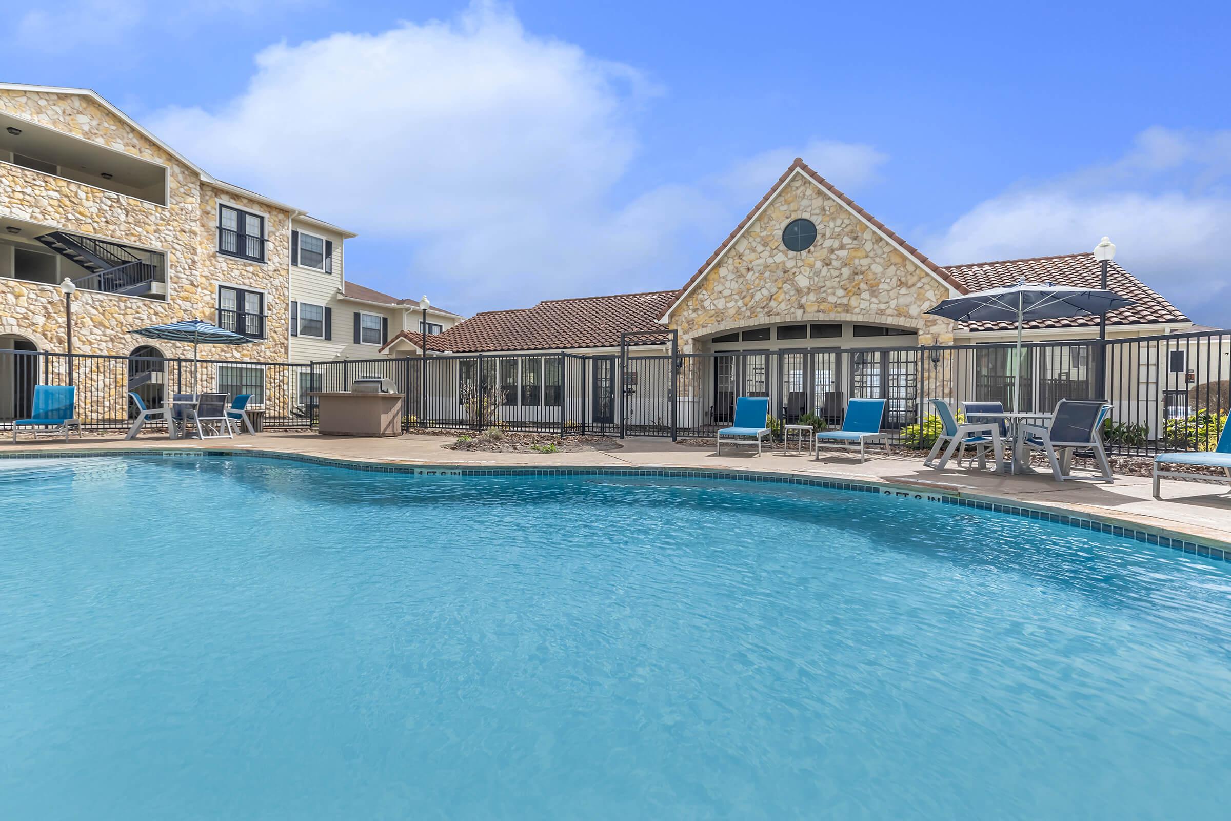 a house with a large pool of water