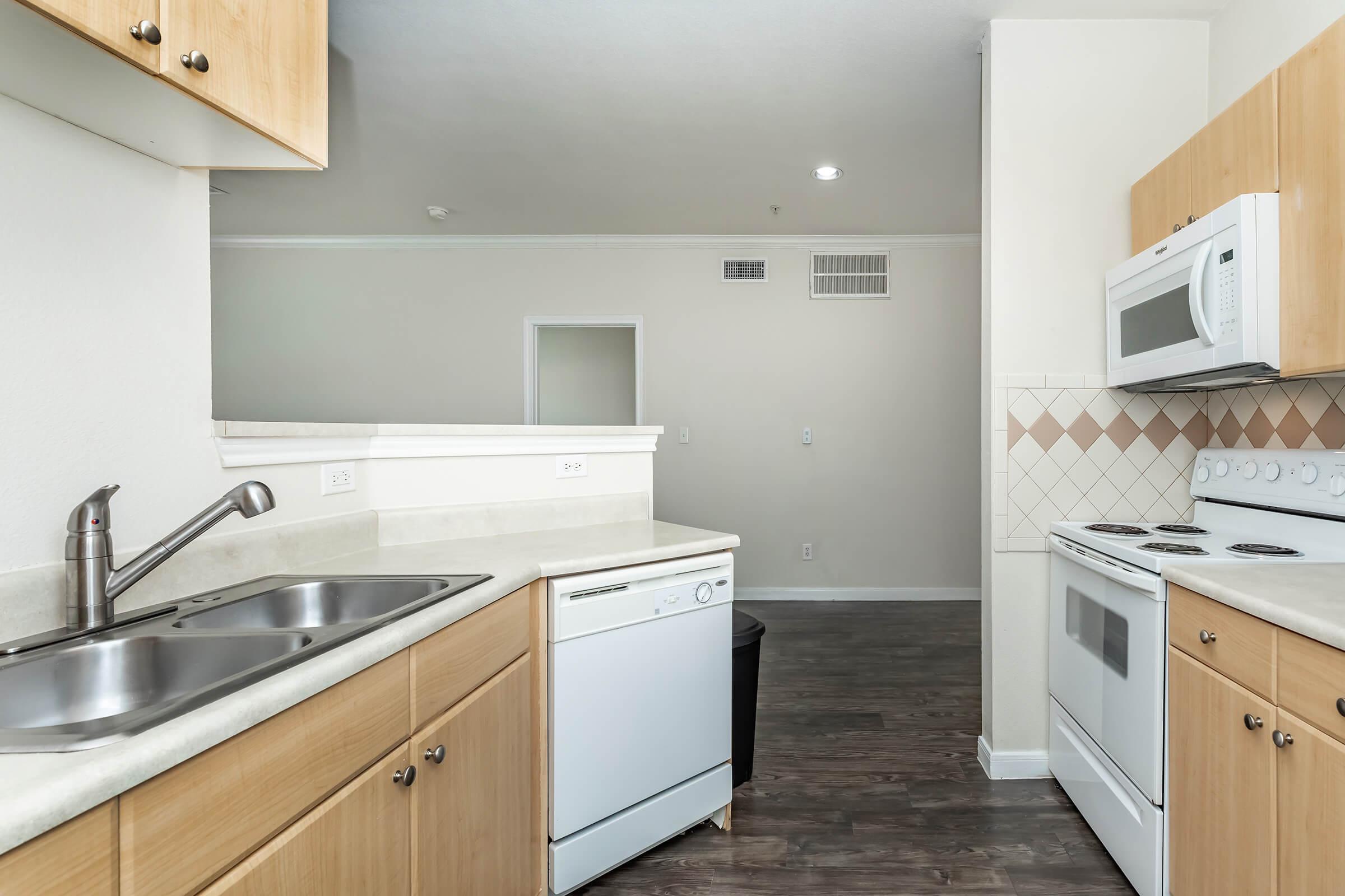 a kitchen with a stove and a sink