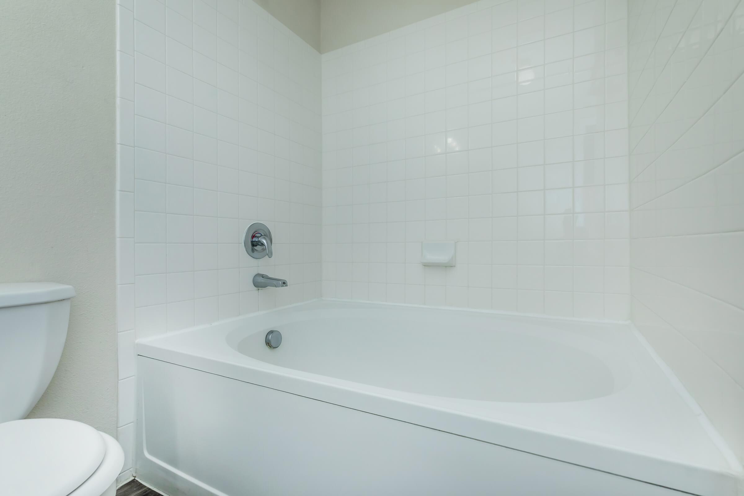 a close up of a sink and a bath tub