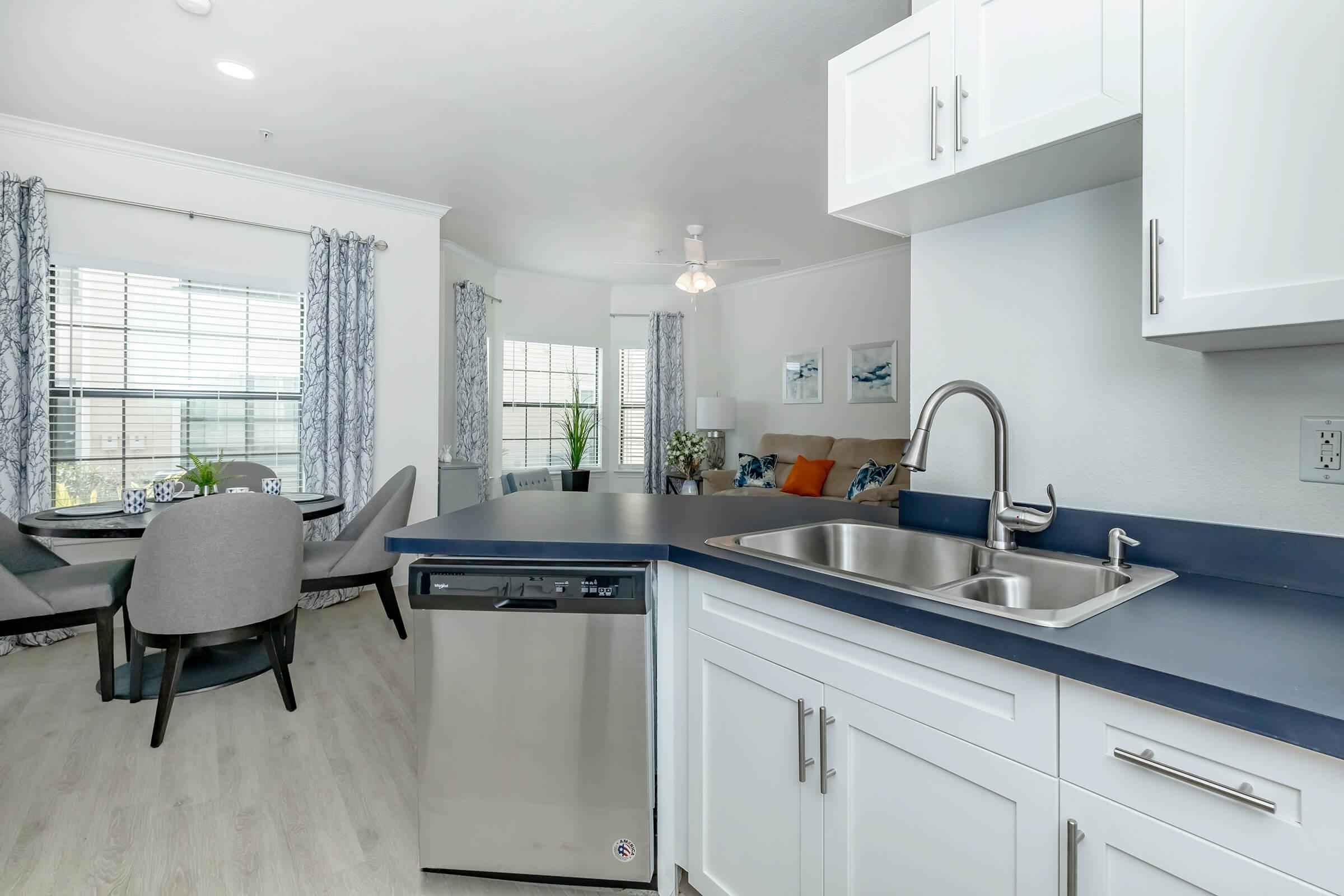 a kitchen with a sink and a window