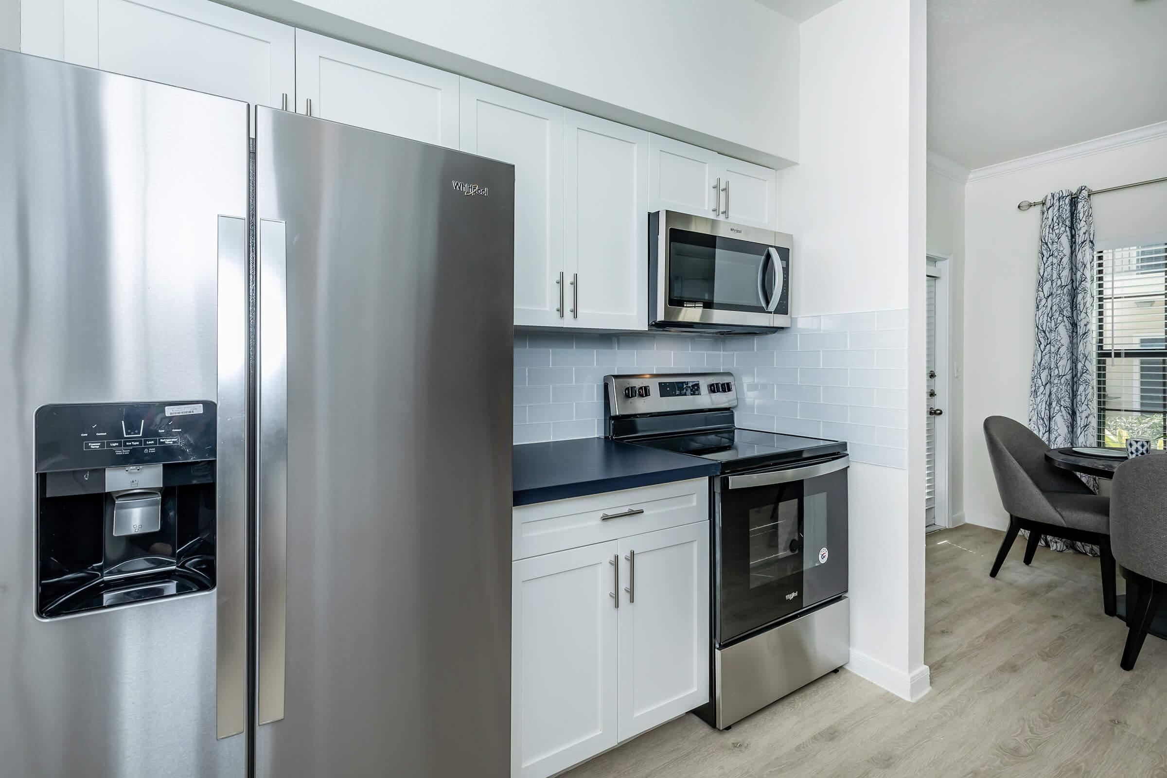 a stainless steel refrigerator in a kitchen