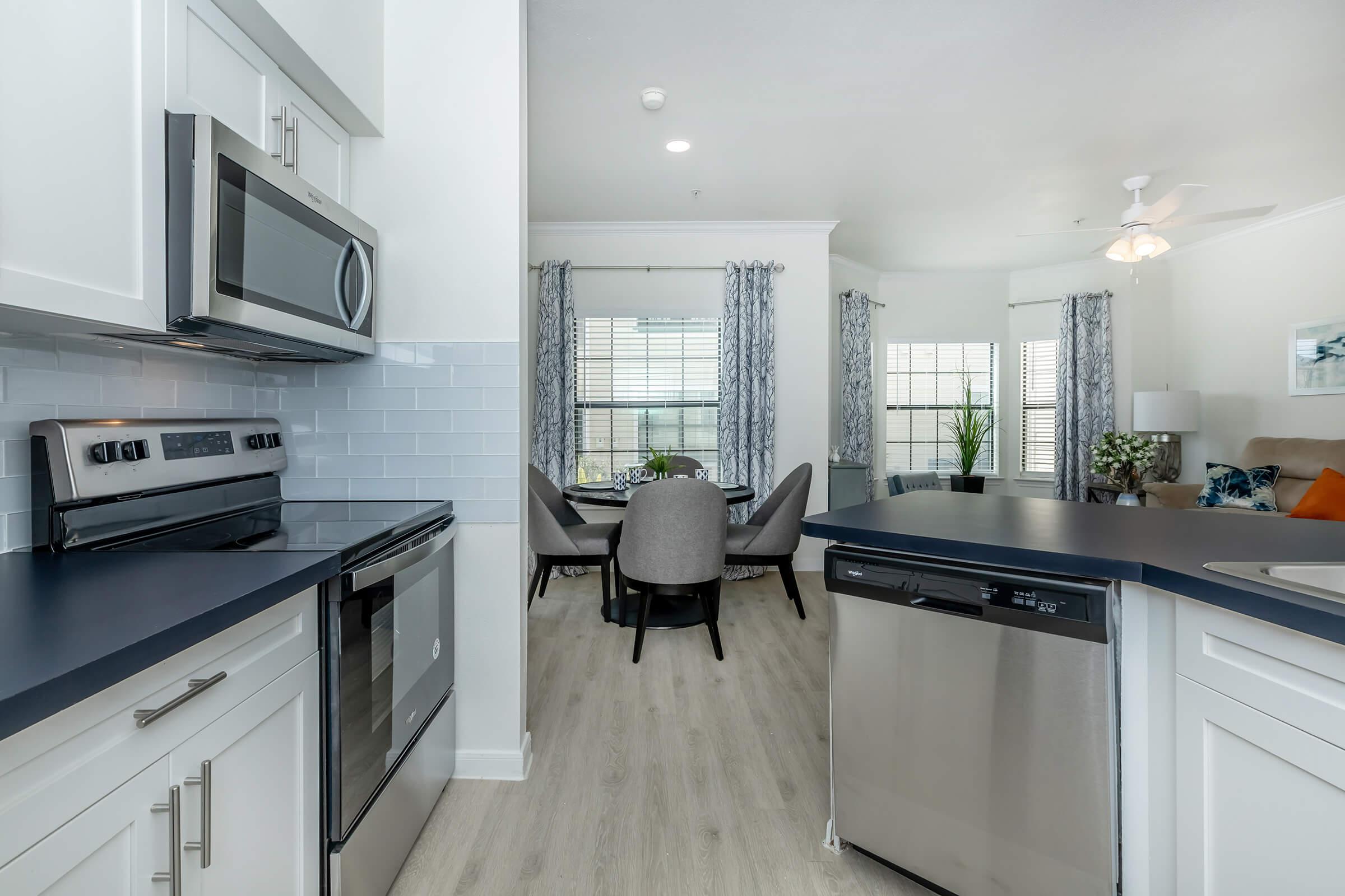 a kitchen with a stove top oven