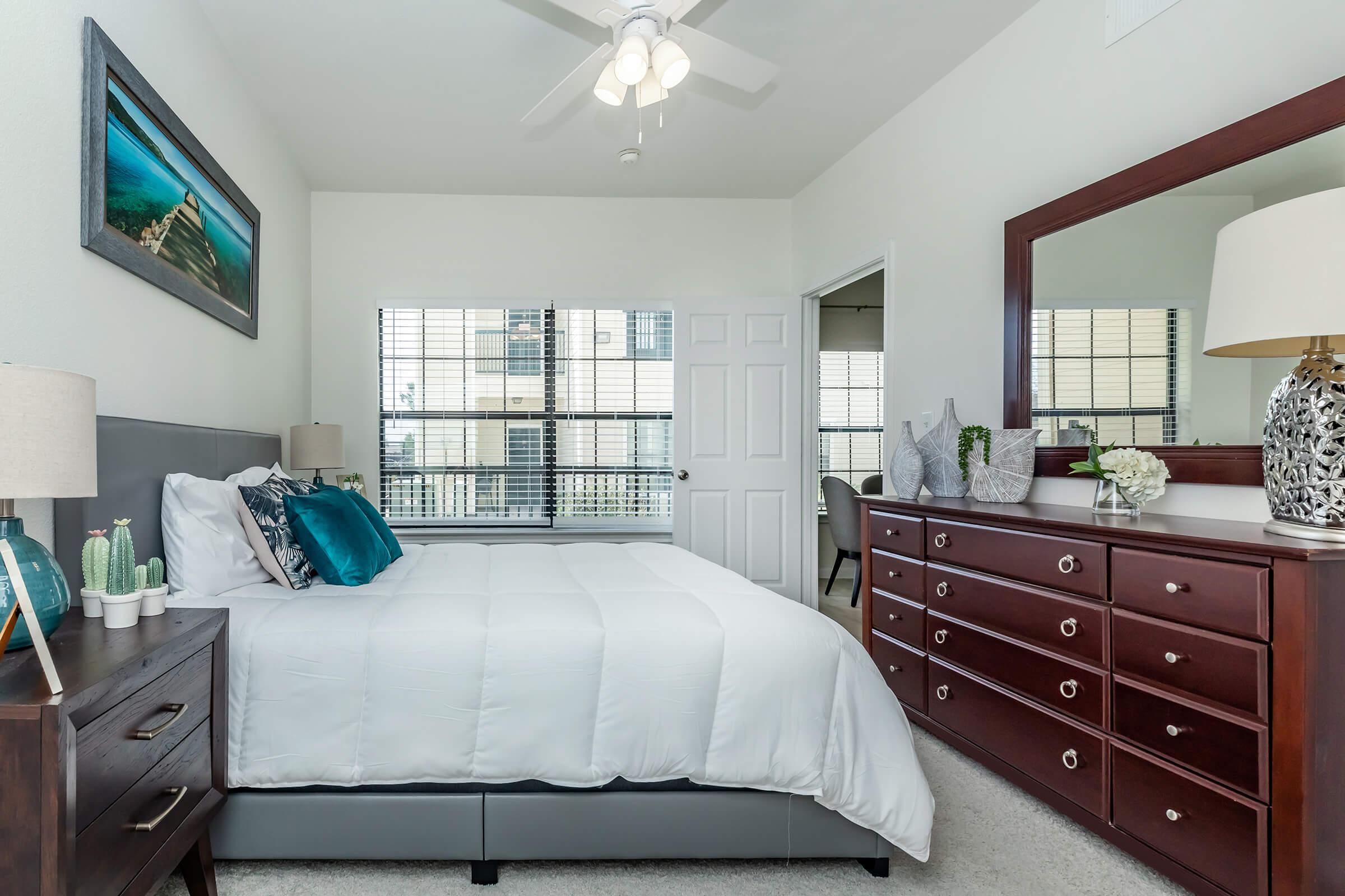 a bedroom with a large bed in a room