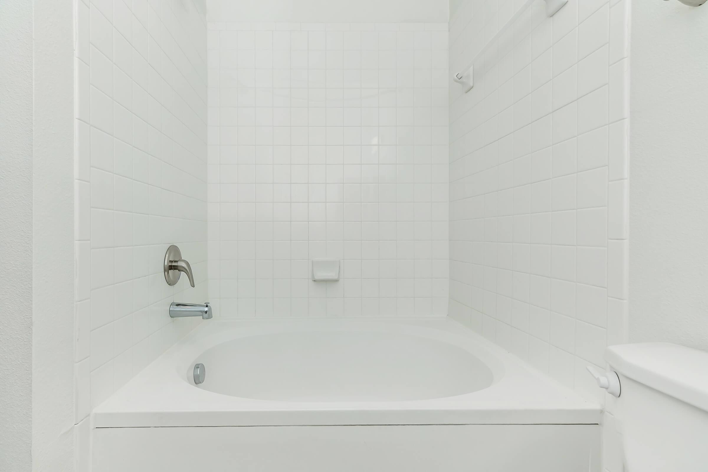 a close up of a sink and a bath tub