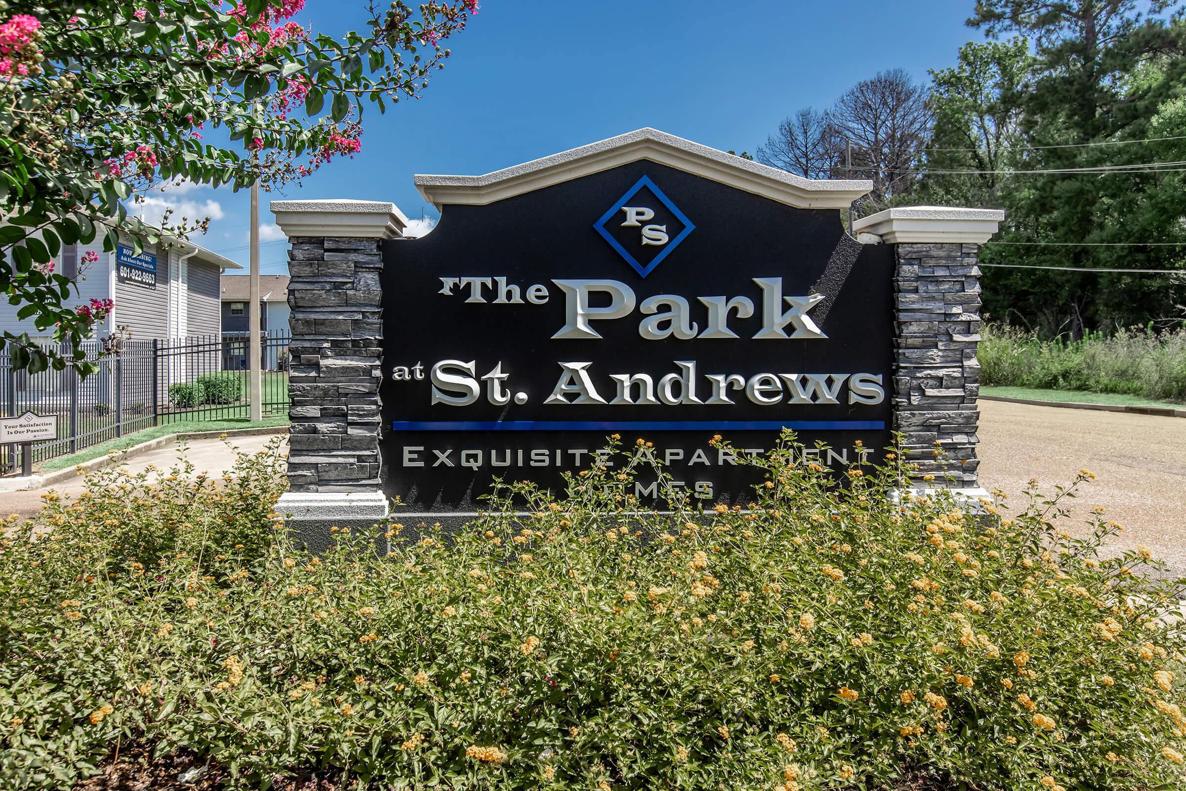 a sign in front of a house