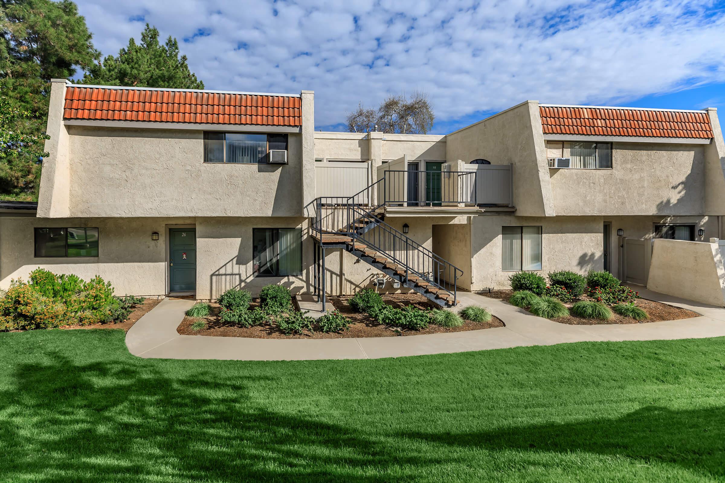 Brookside Park Apartments community building with green grass