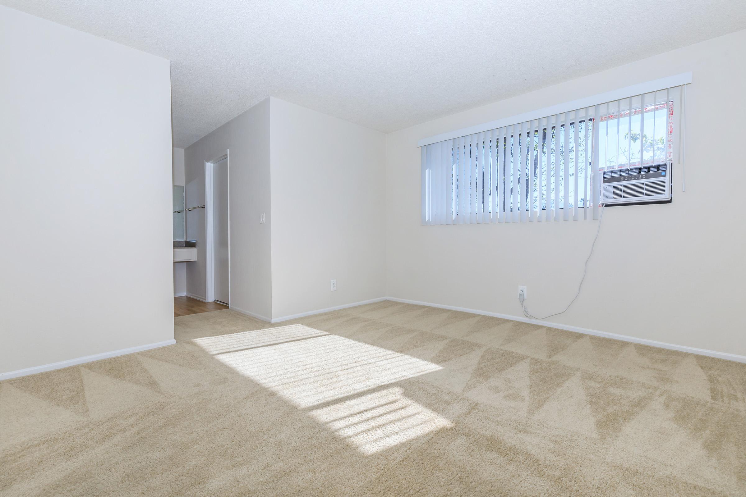 vacant bedroom with an attached sink