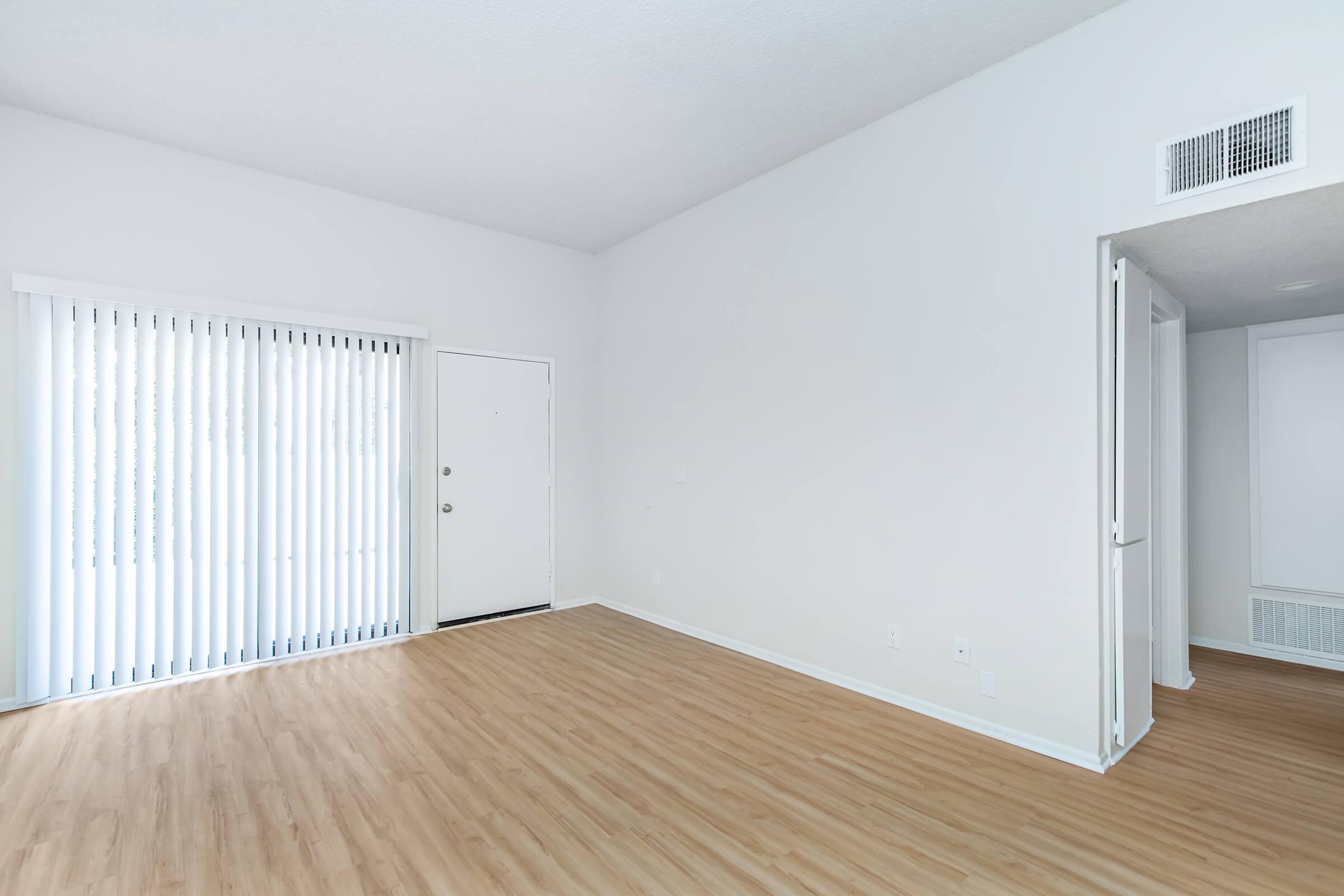 living room and hallway with wooden floors