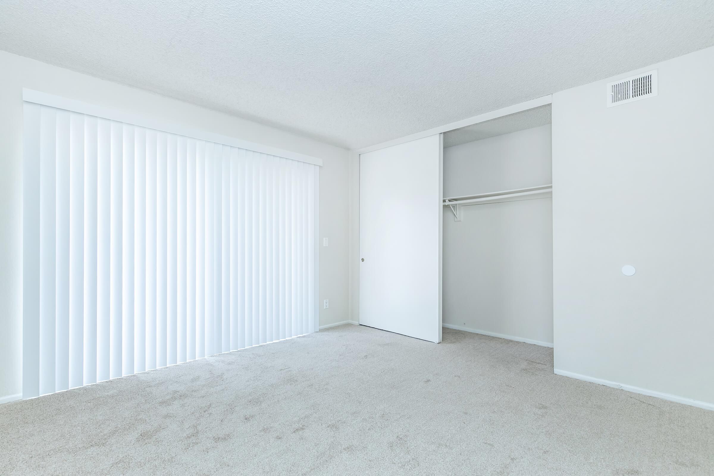 bedroom with white window shades