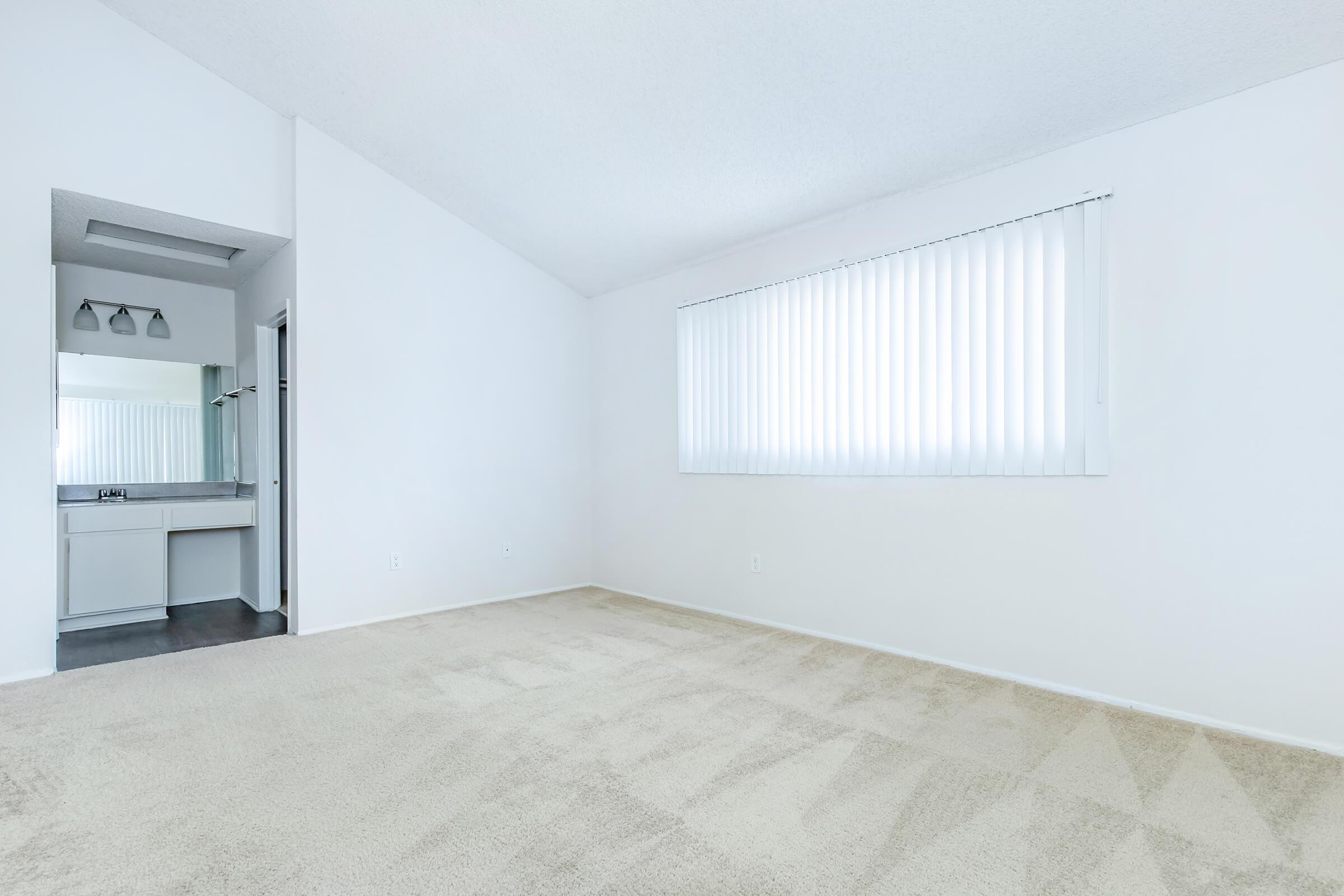 unfurnished bedroom with attached sink