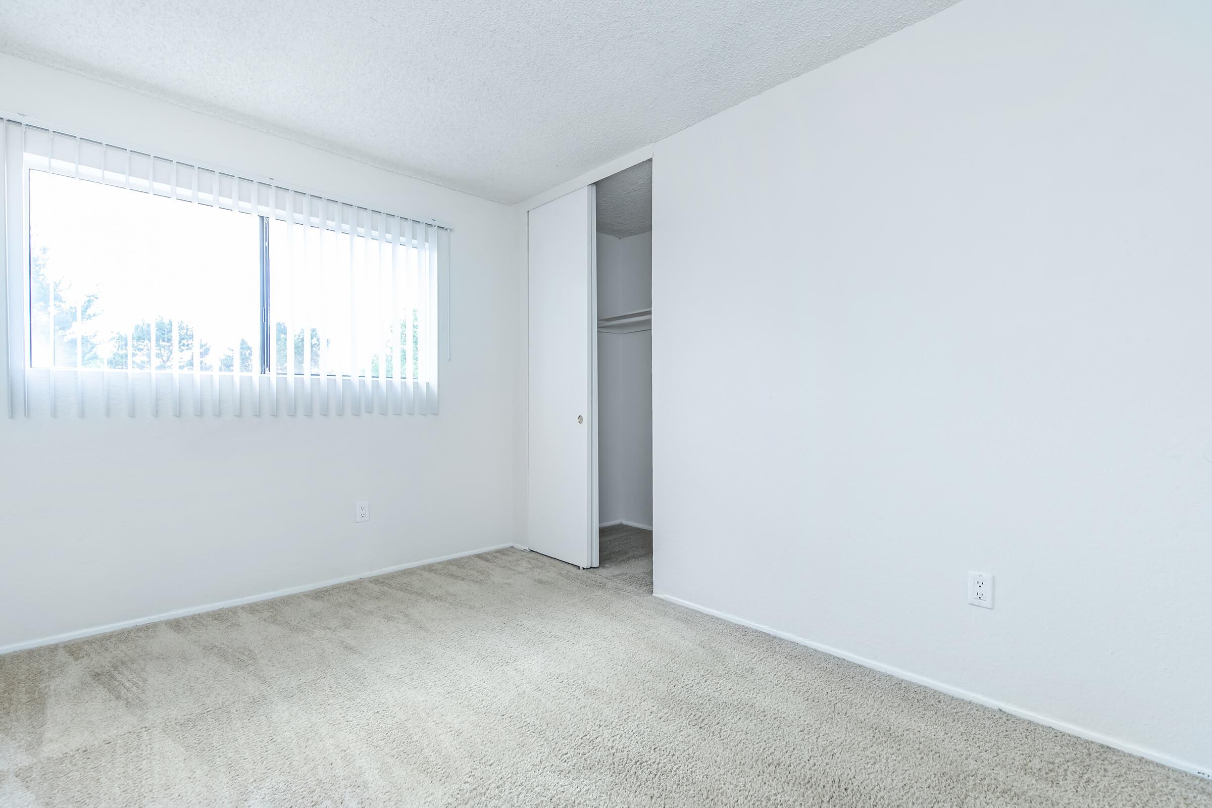 unfurnished bedroom with walk-in closet