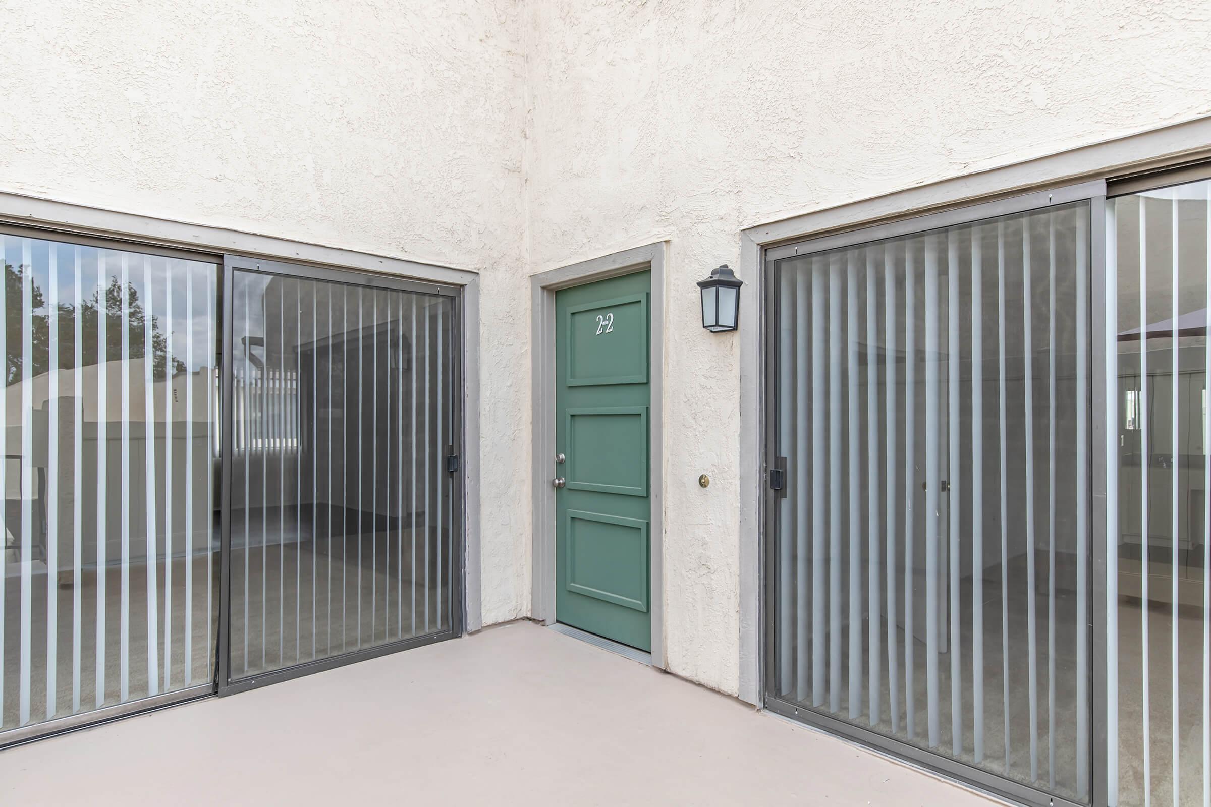 patio with sets of glass sliding doors