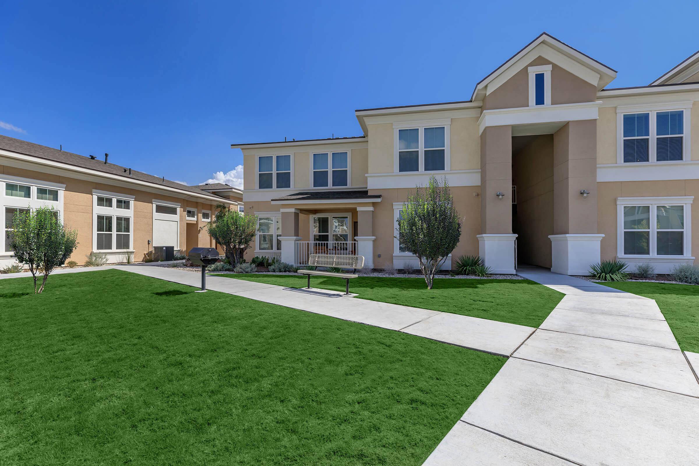 a large lawn in front of a house