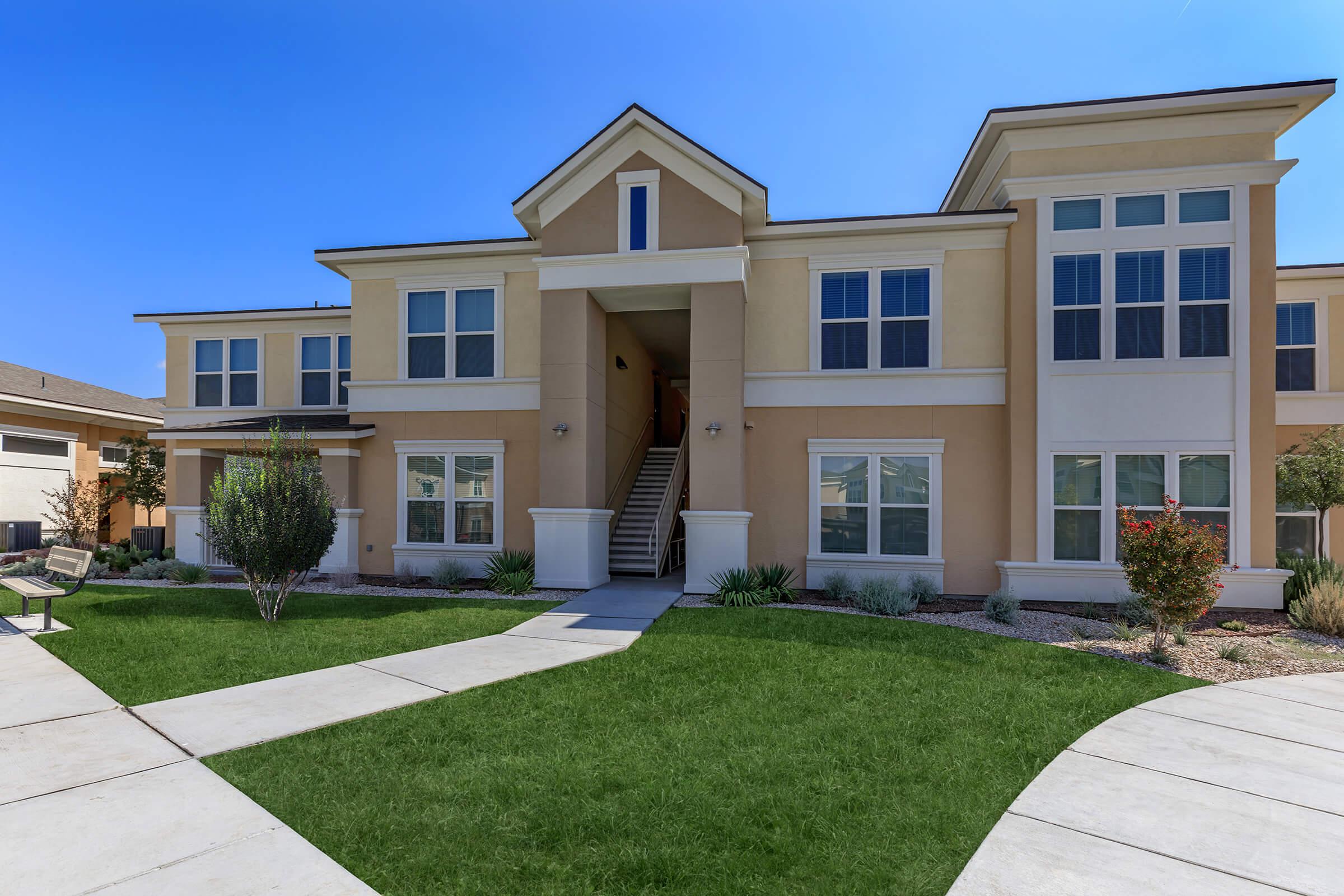 a large lawn in front of a house