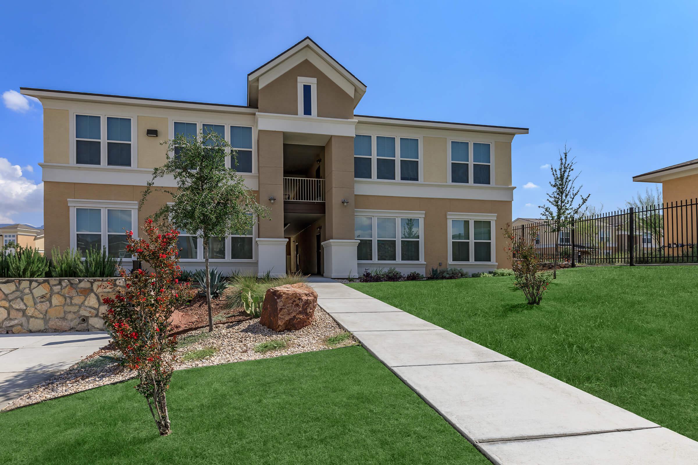 a large lawn in front of a house