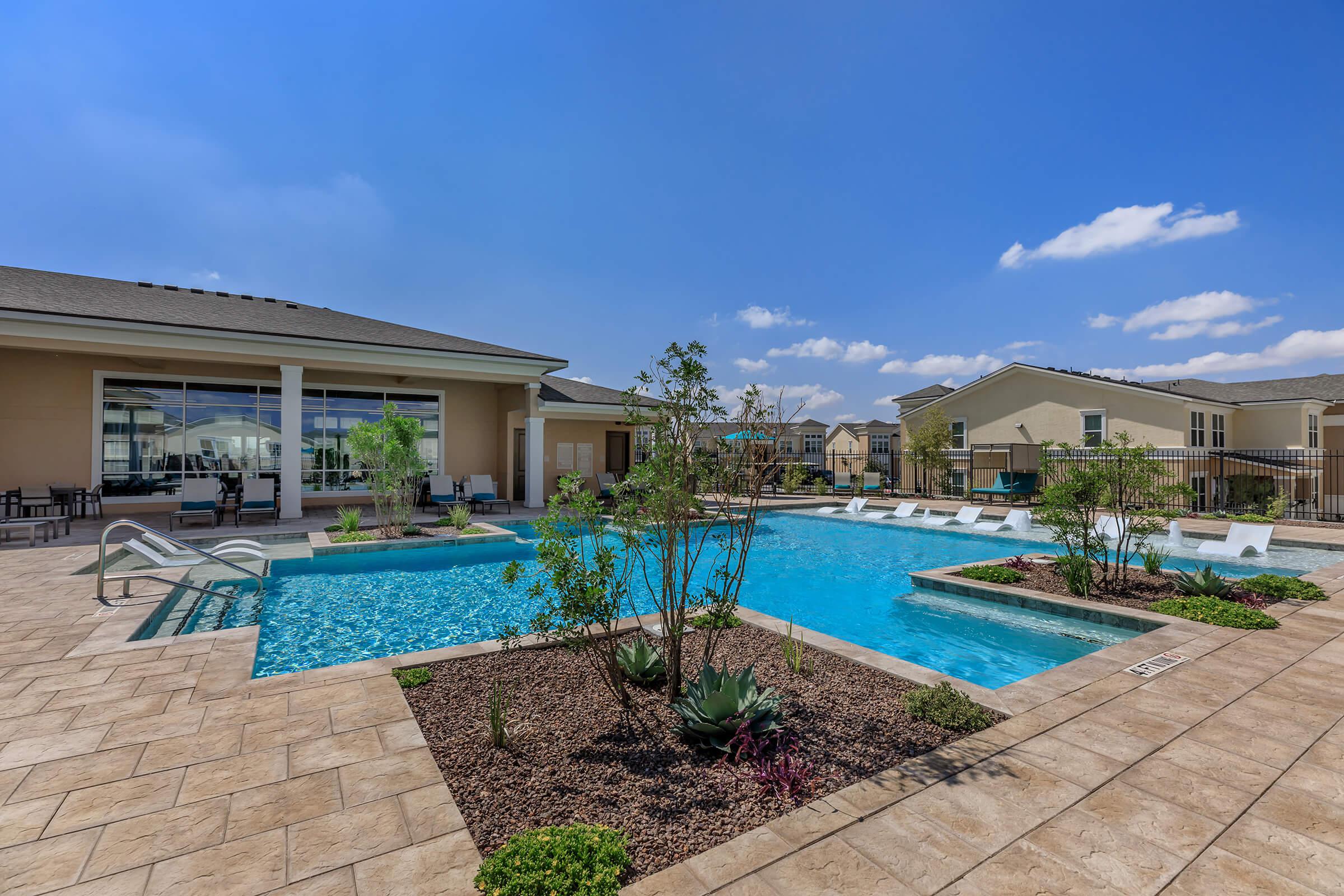 a house with a pool outside of a building