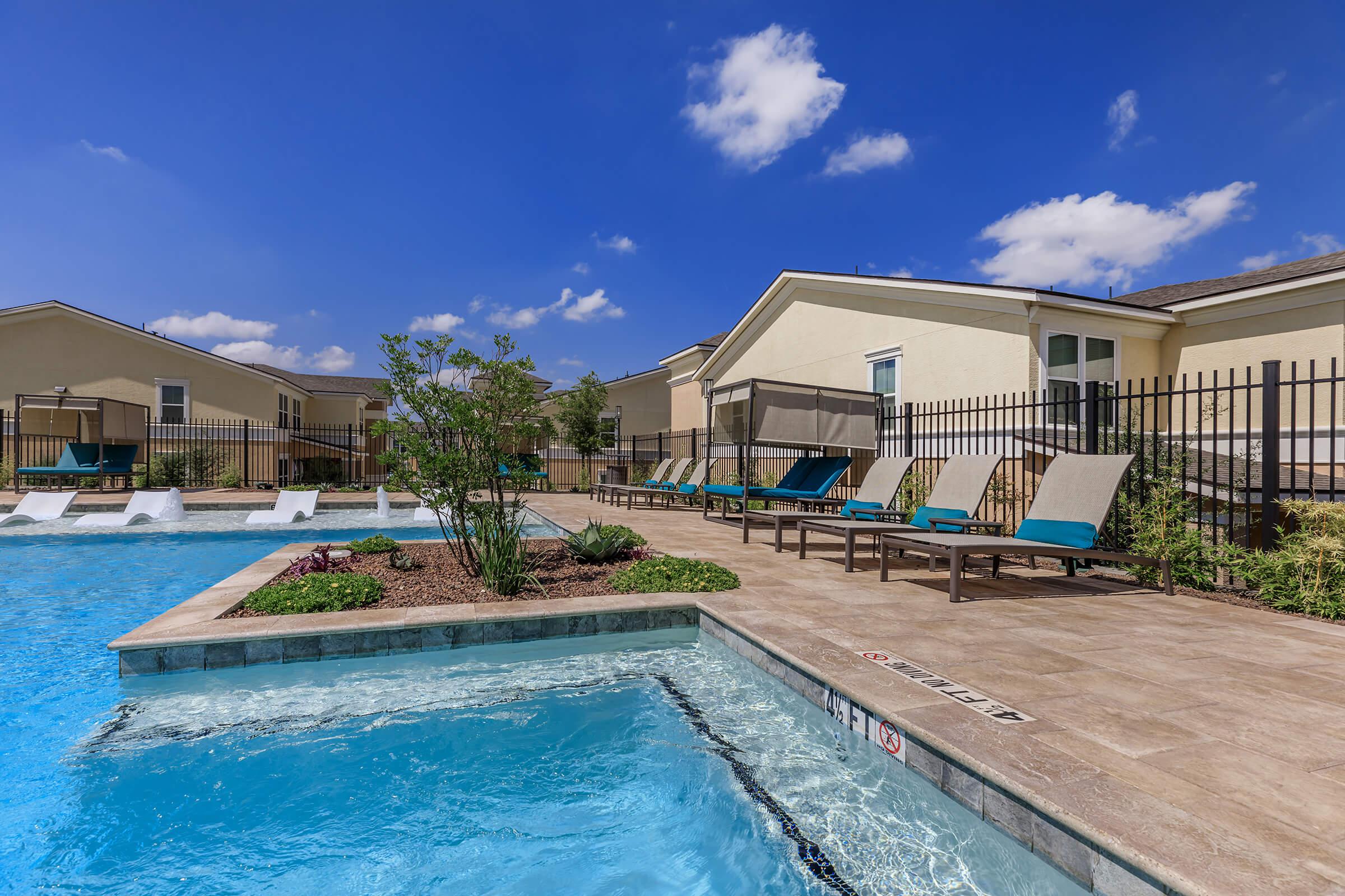 a house with a pool outside of a building