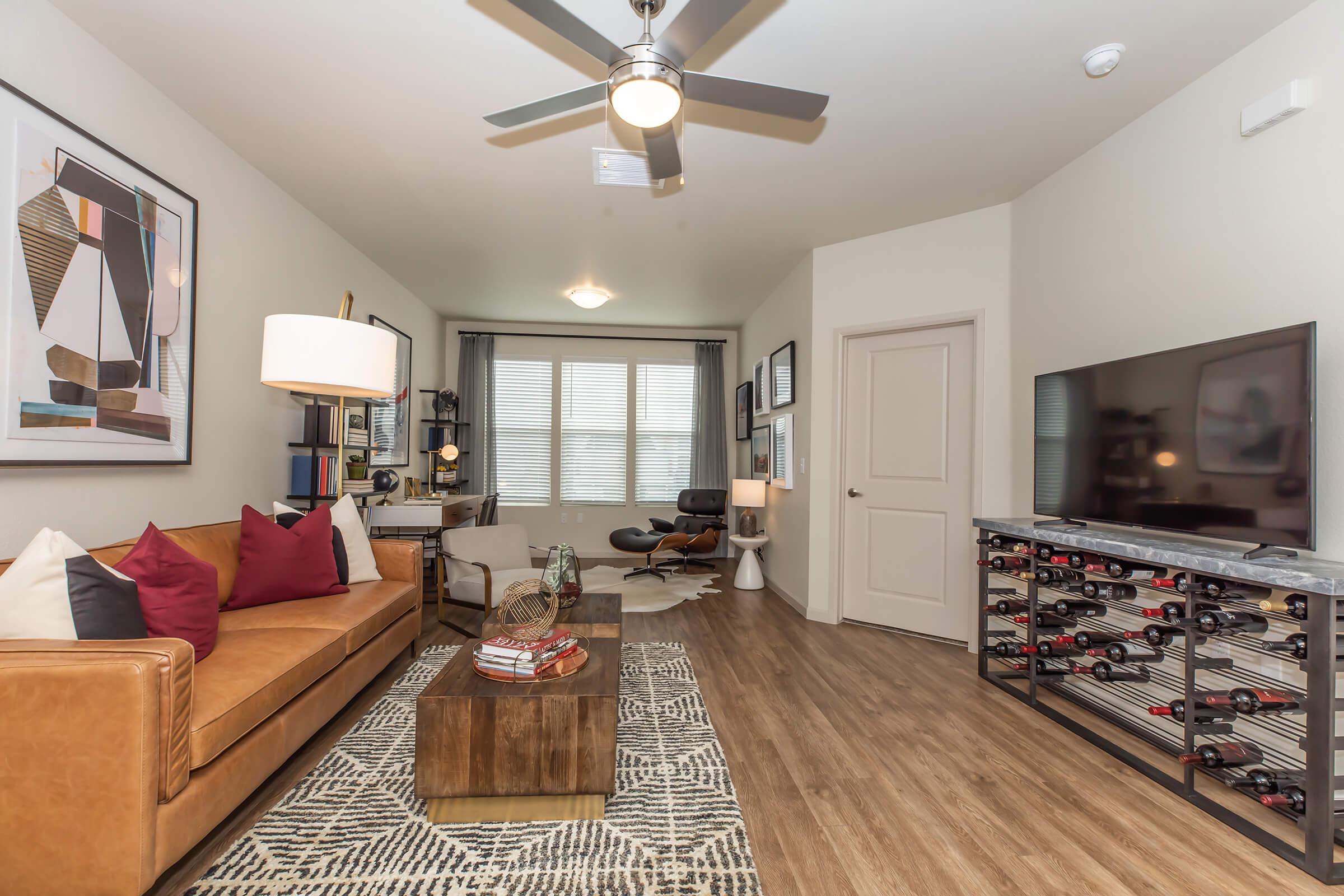 a living room filled with furniture and a fireplace