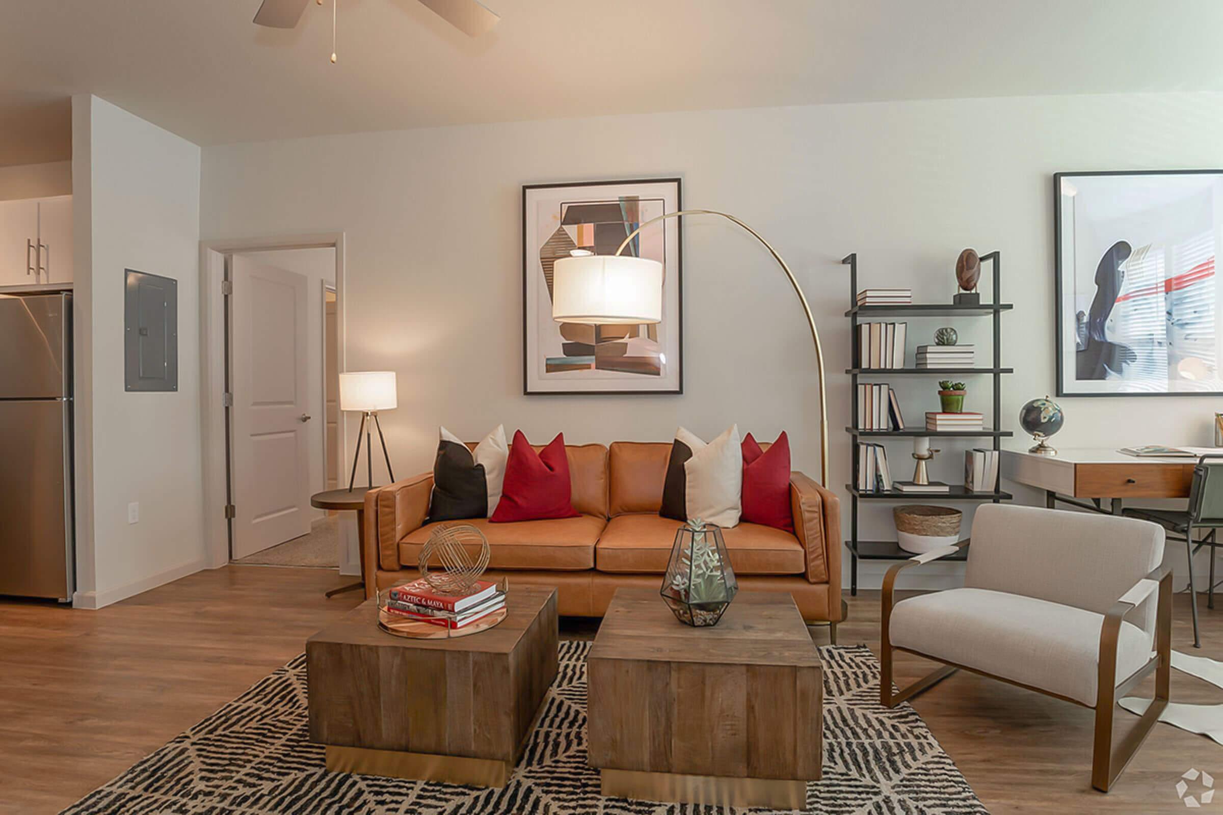 a living room filled with furniture and a fireplace