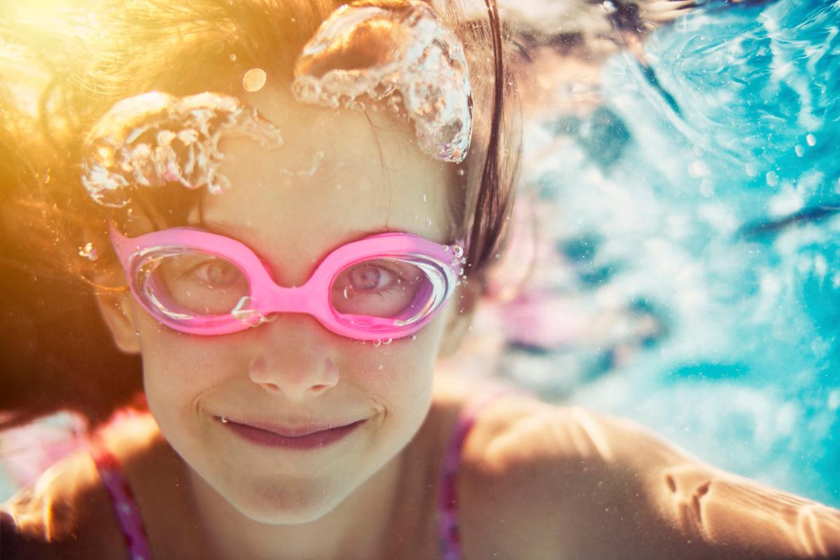 Little girl swimming underwater iStock_000054790392_Large.jpg