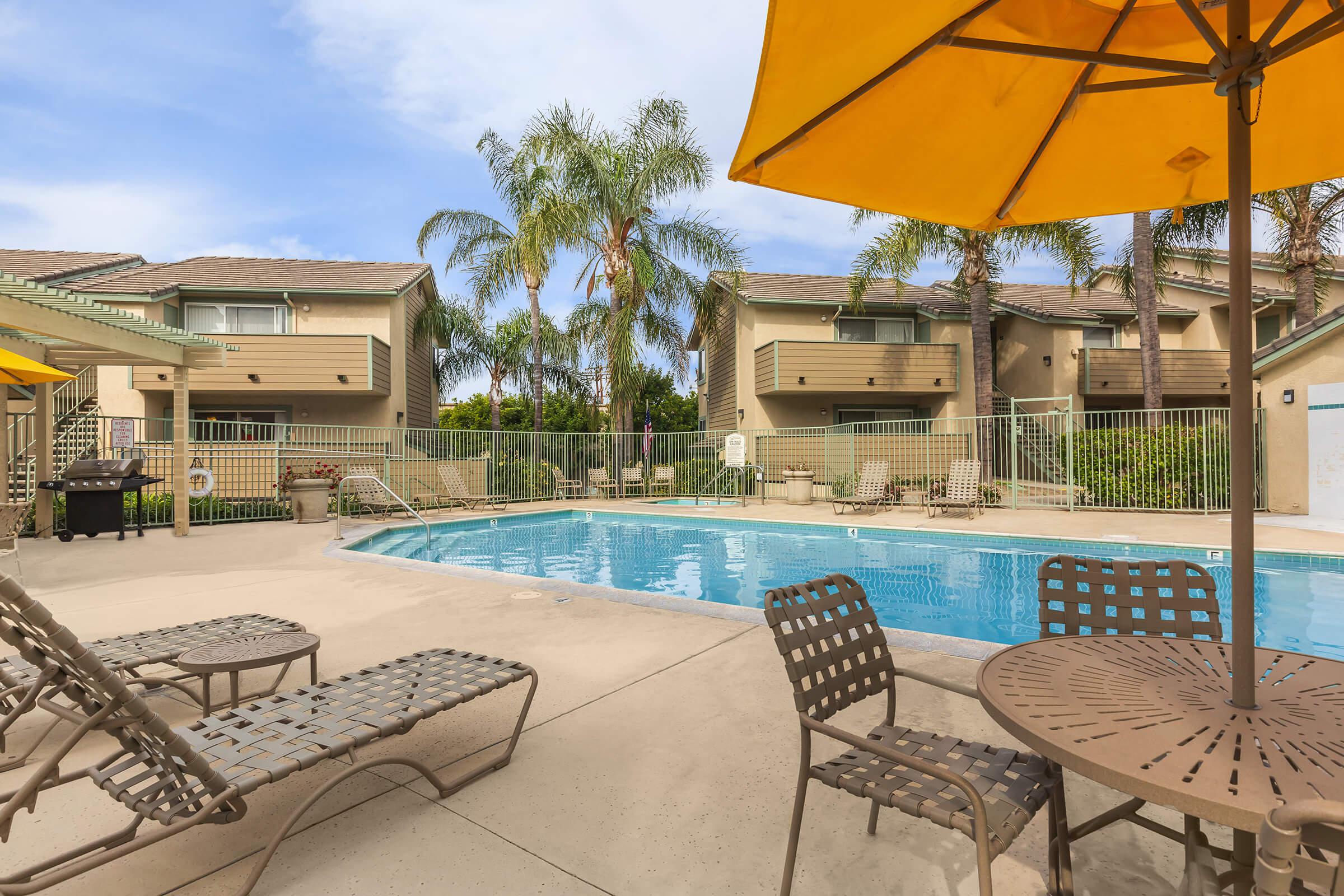 Community pool with chairs and table