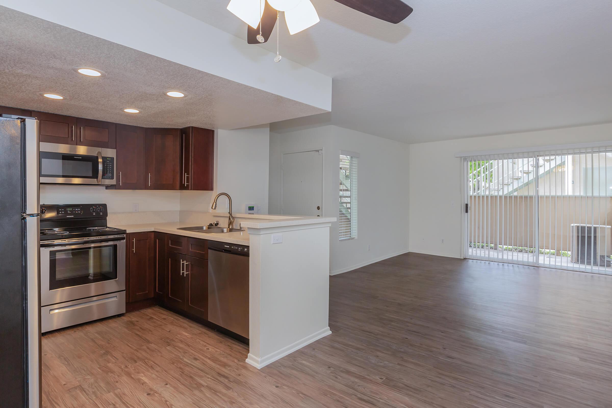 Kitchen with living room in the background