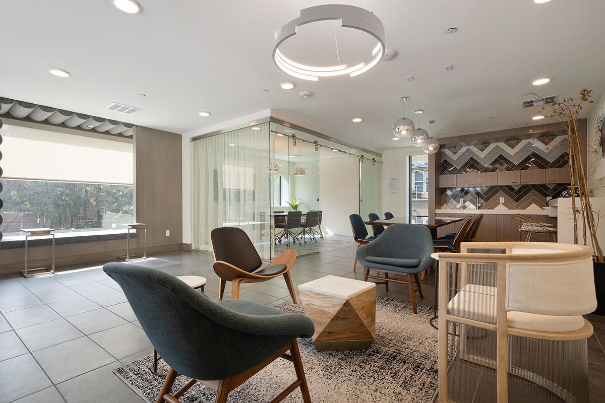 a living room filled with furniture and a large window