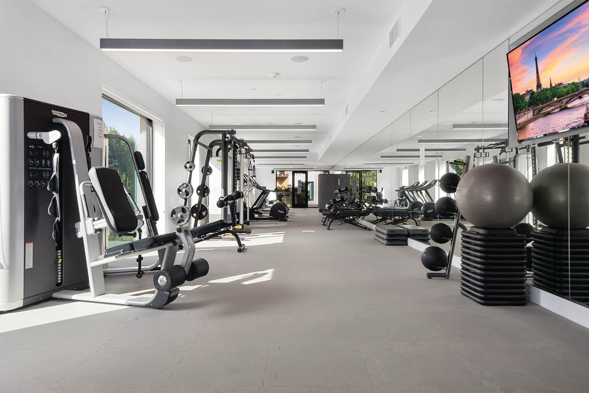 Use Prisma apartments 24 hour fitness center that features free weights, machines, cardio, and TRX