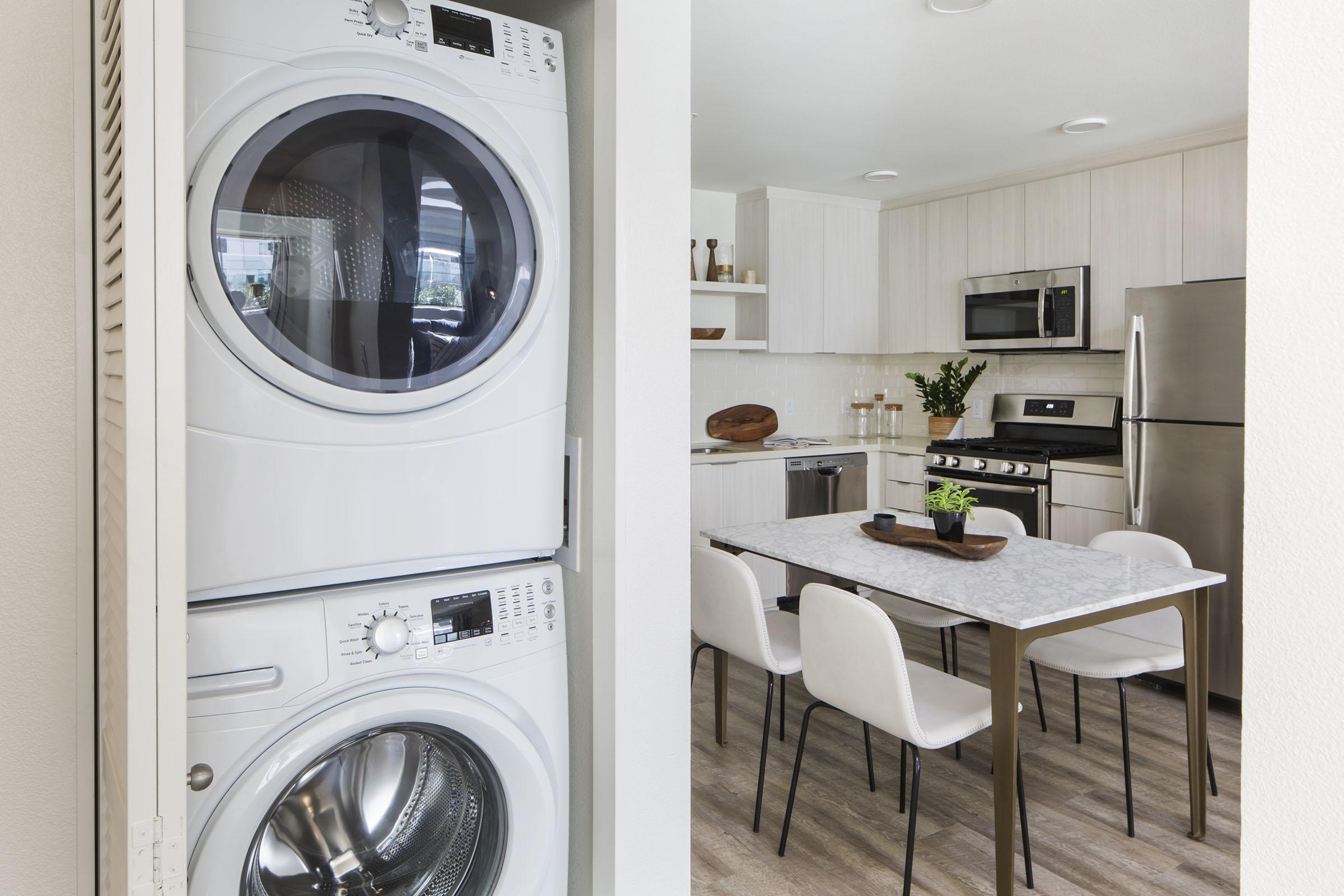 a kitchen with a sink and a mirror