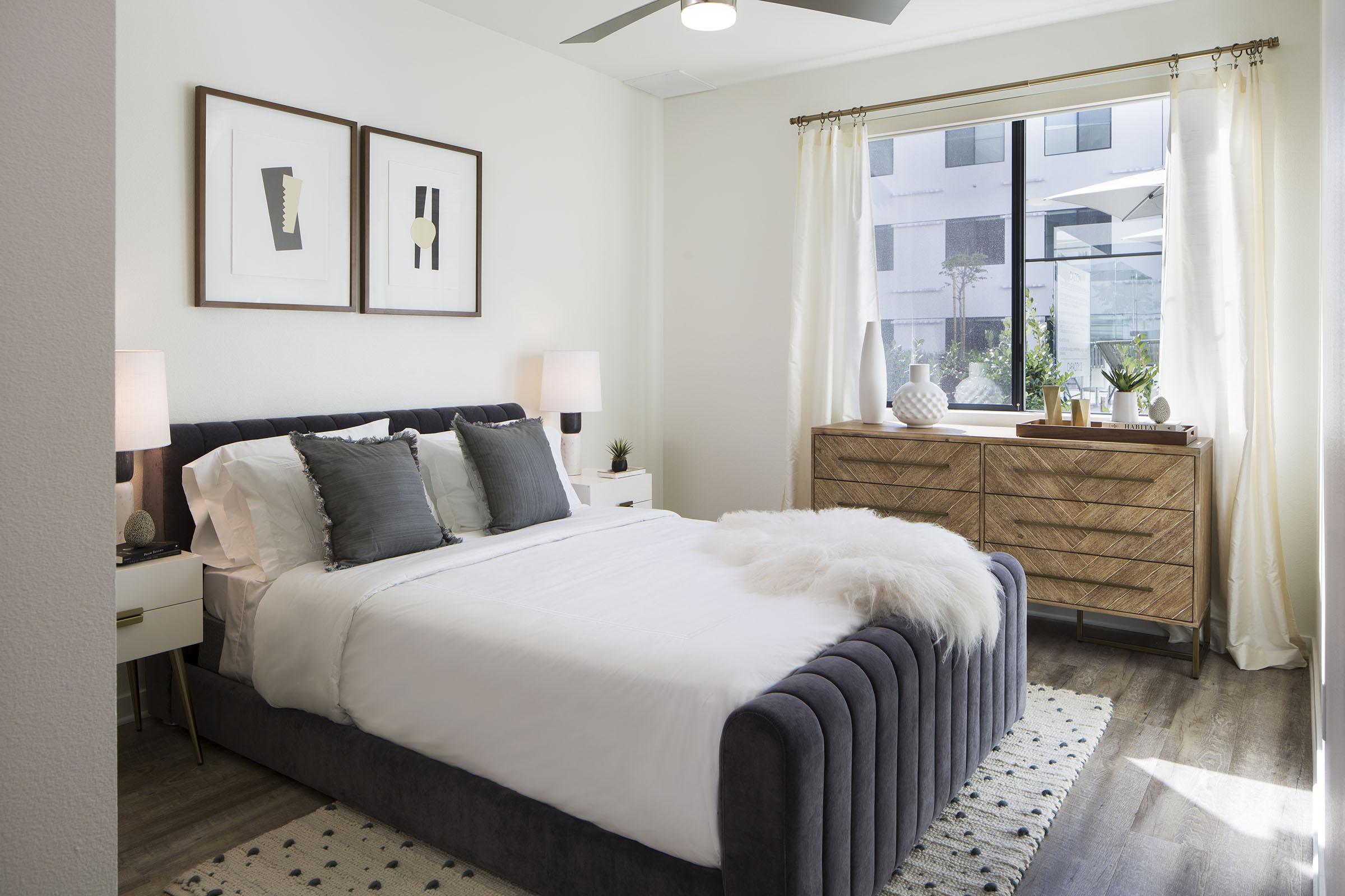 a bedroom with a large bed in a hotel room