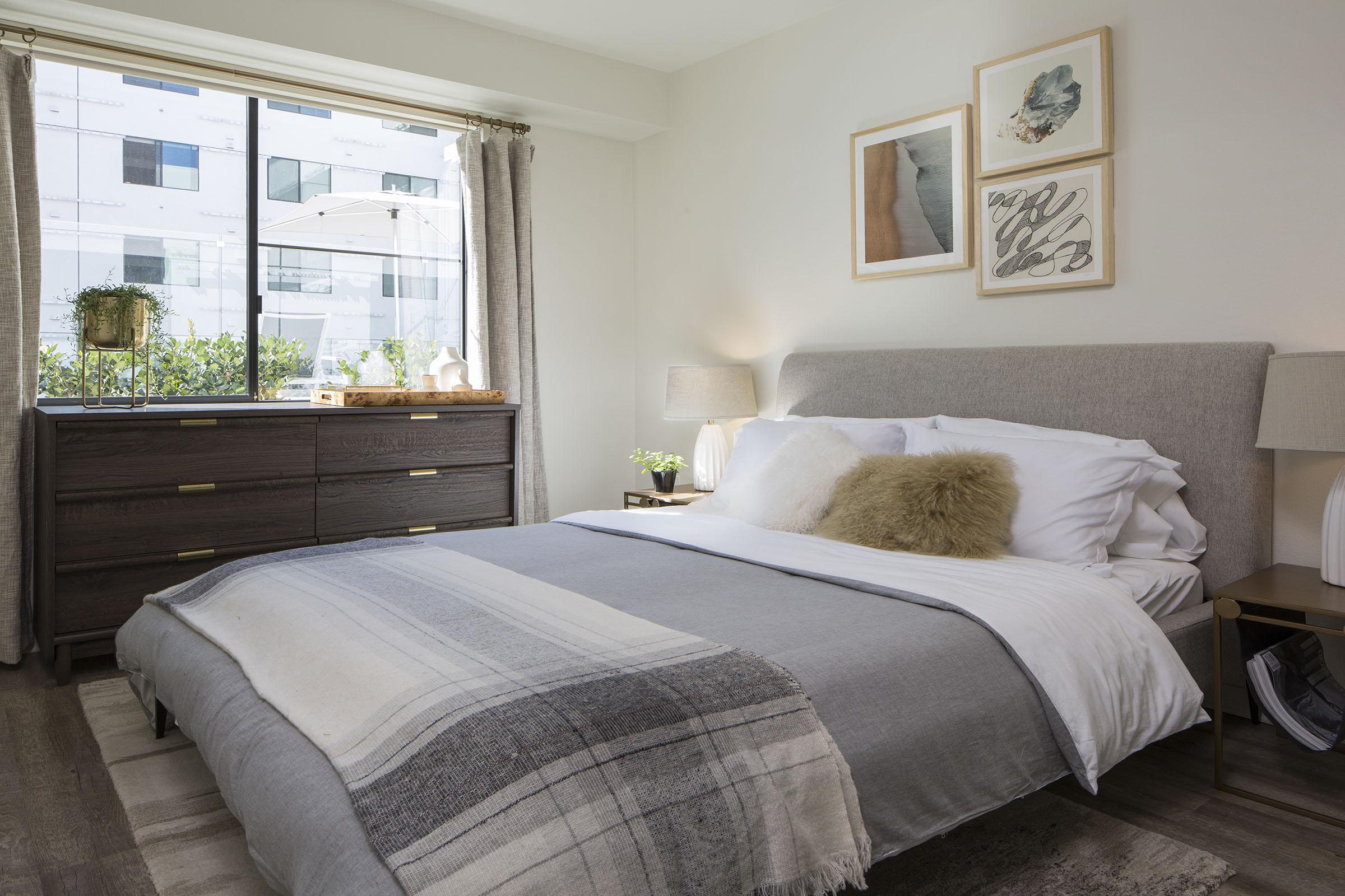 a bedroom with a large bed in a hotel room