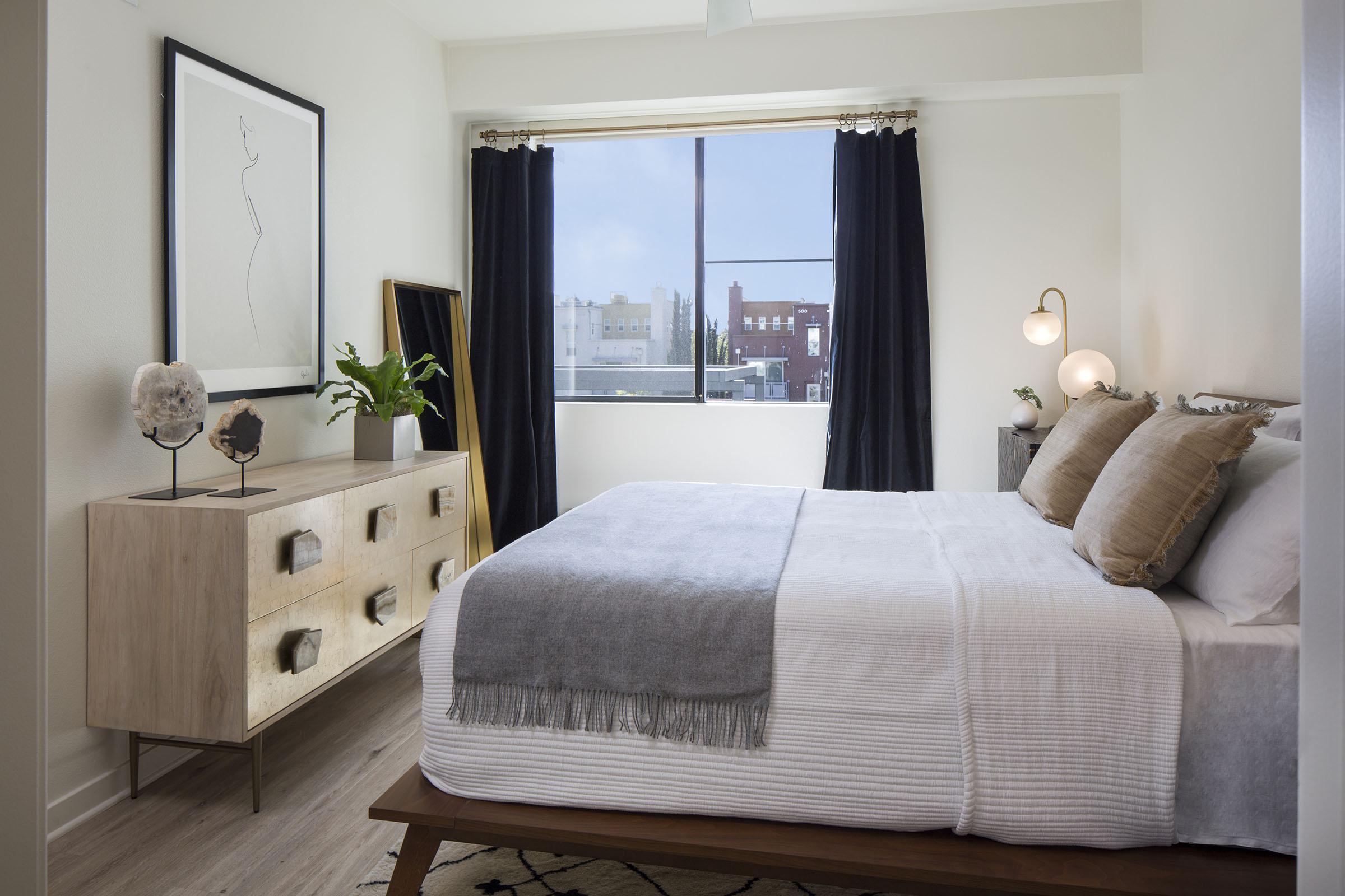 a bedroom with a large bed in a room
