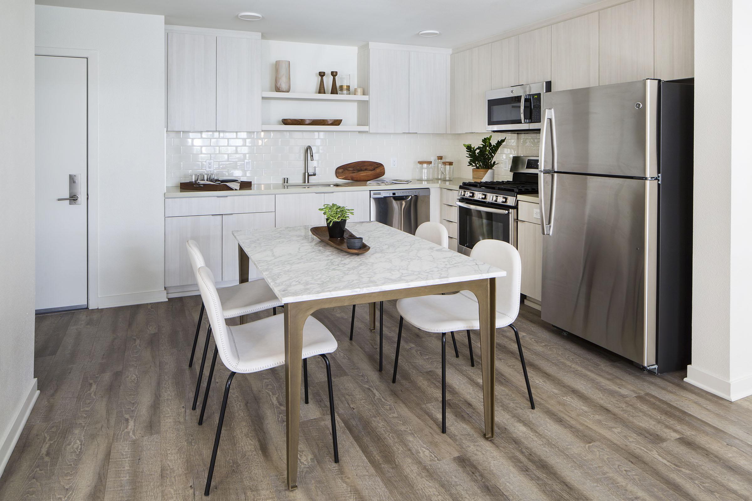 a kitchen with a dining room table
