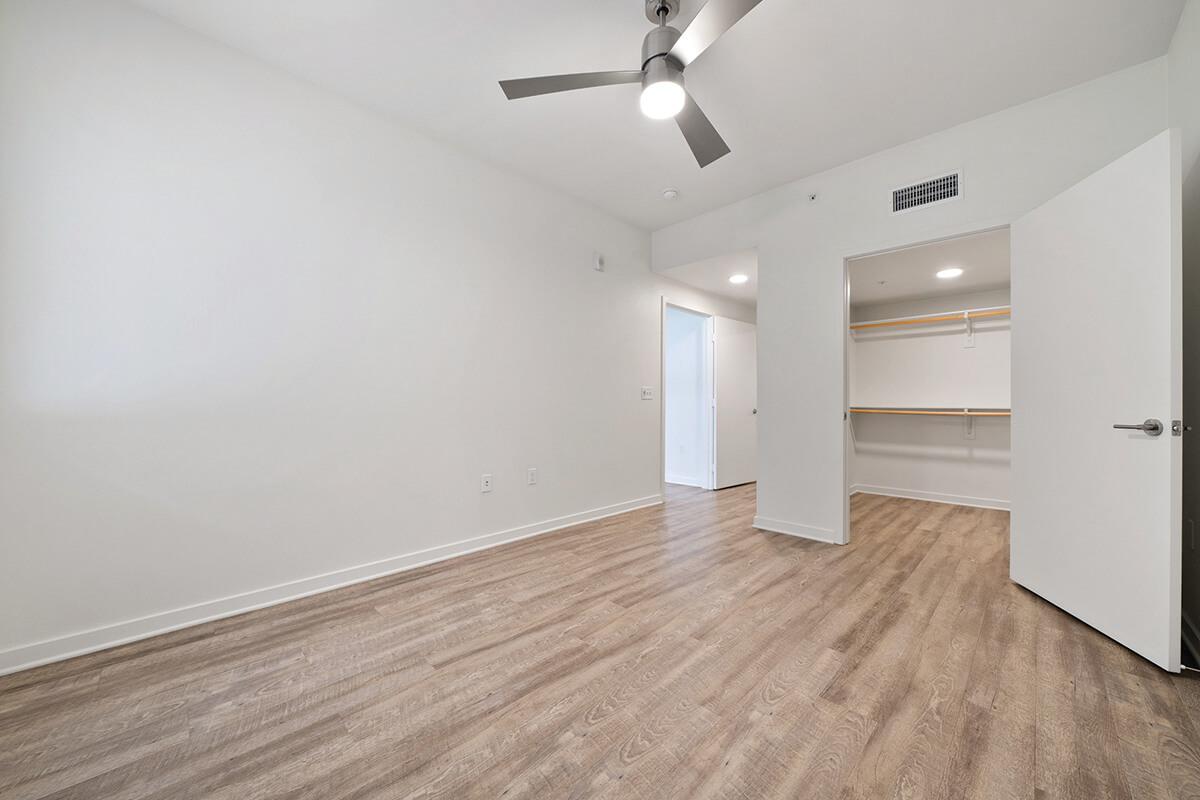 a large empty room with a wood floor