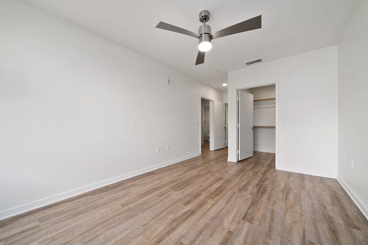 a large empty room with a wood floor
