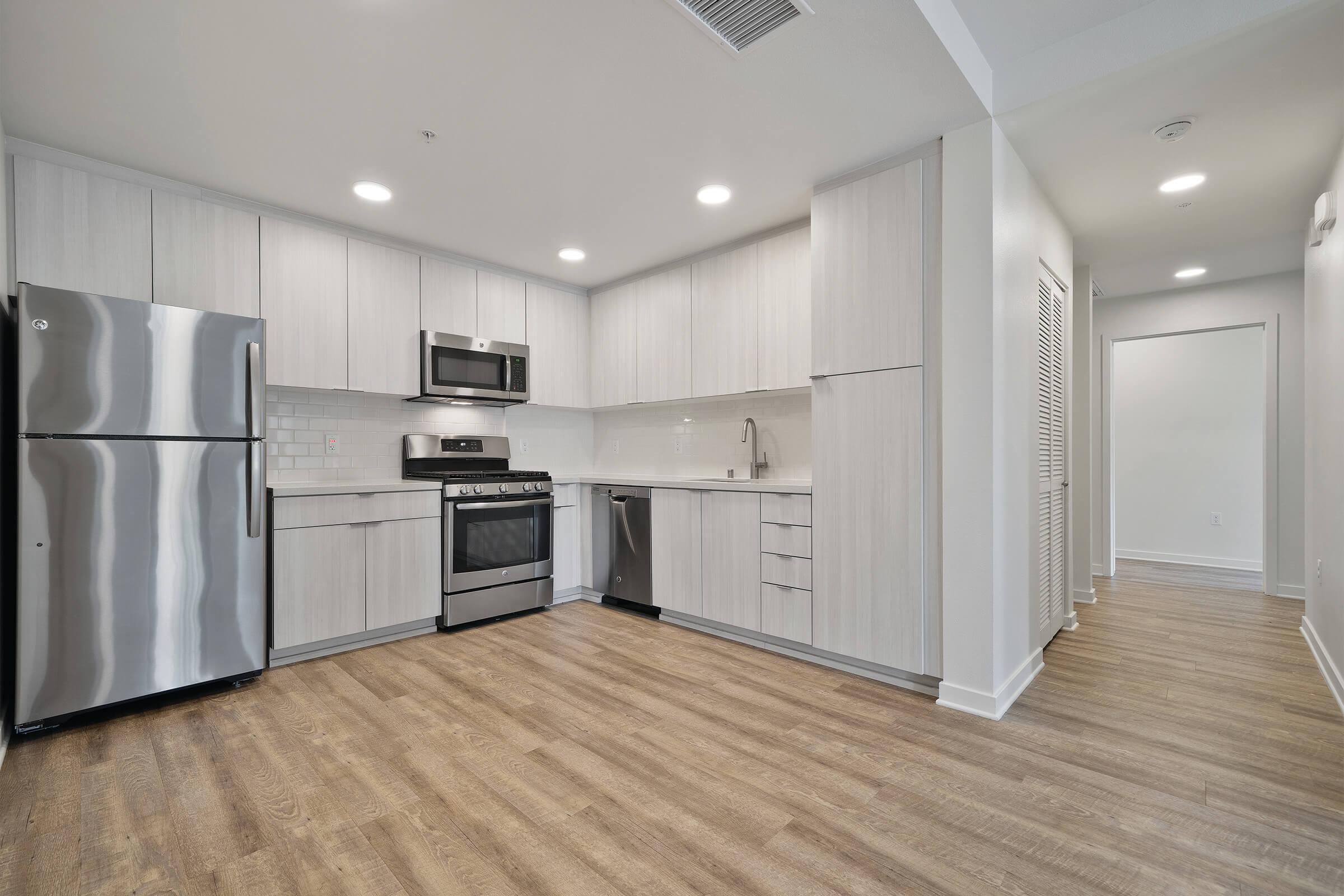 Kitchens in each one and two bedroom apartments feature stainless or slate finish appliances