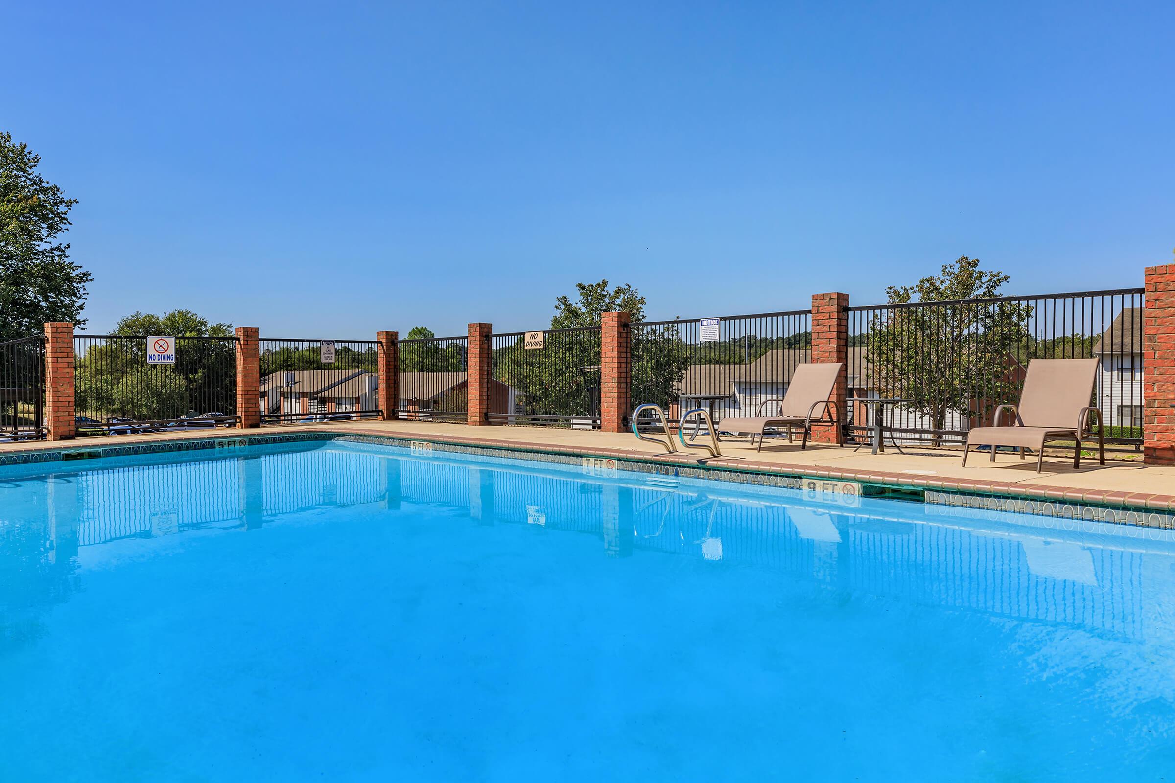 a pool next to a body of water