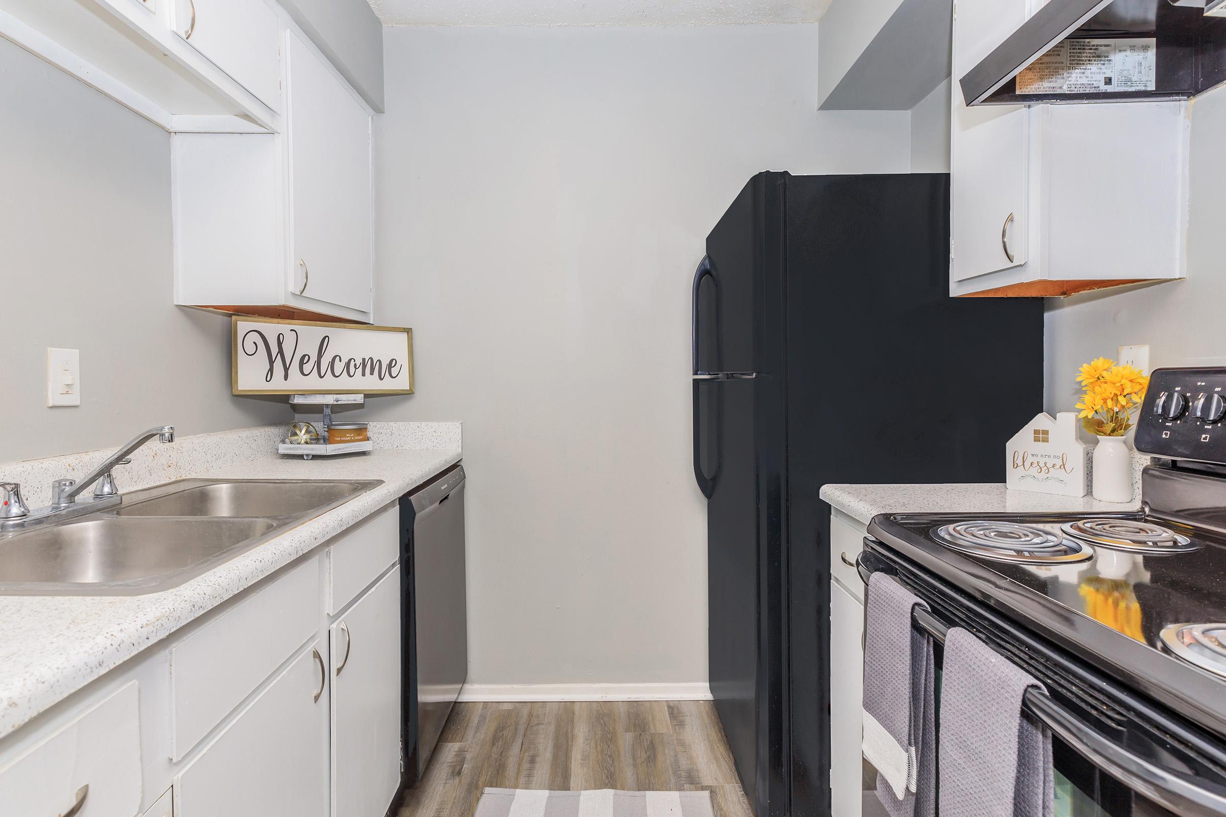 a kitchen with a stove top oven sitting inside of a refrigerator