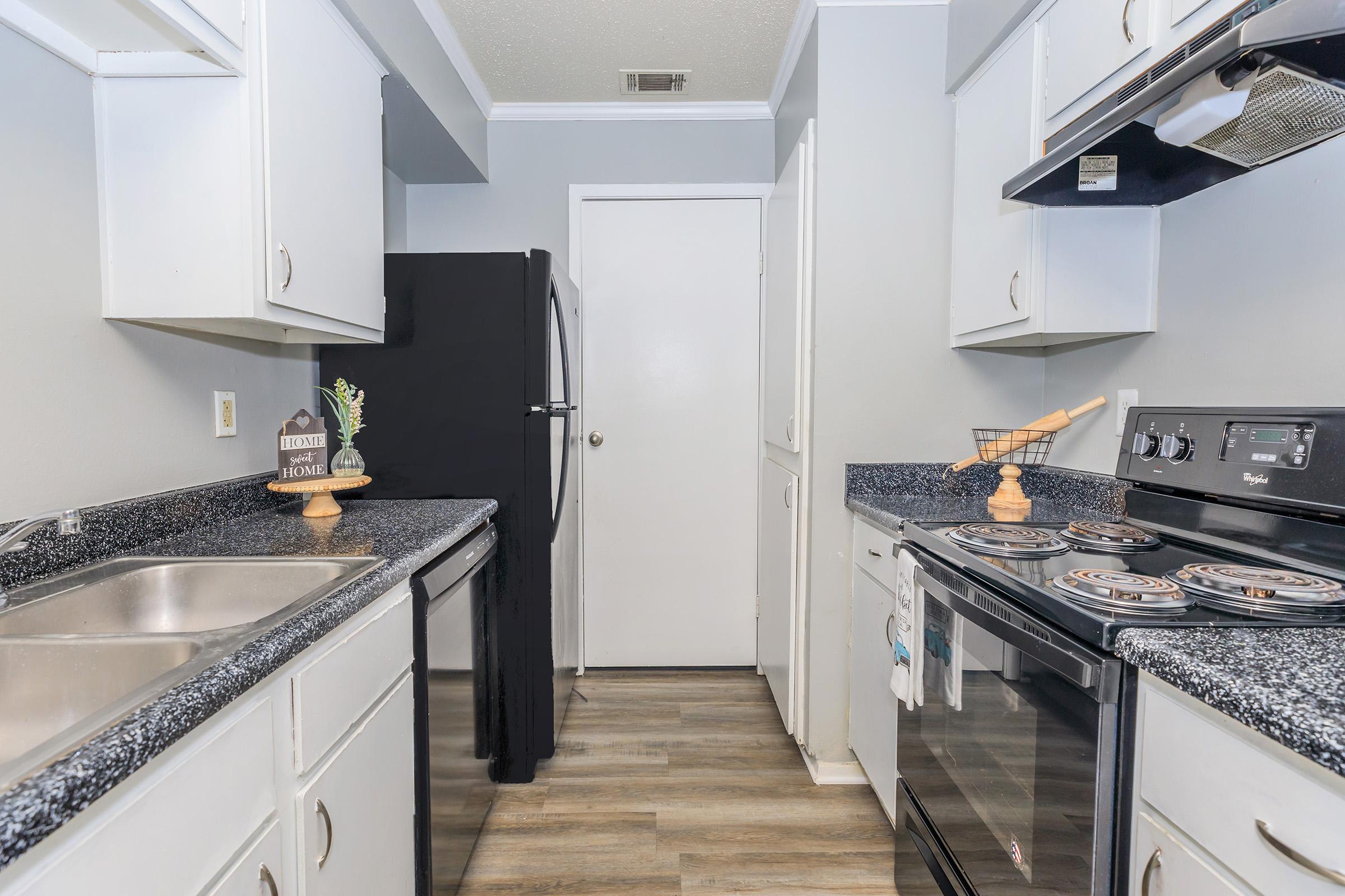 a kitchen with a stove top oven