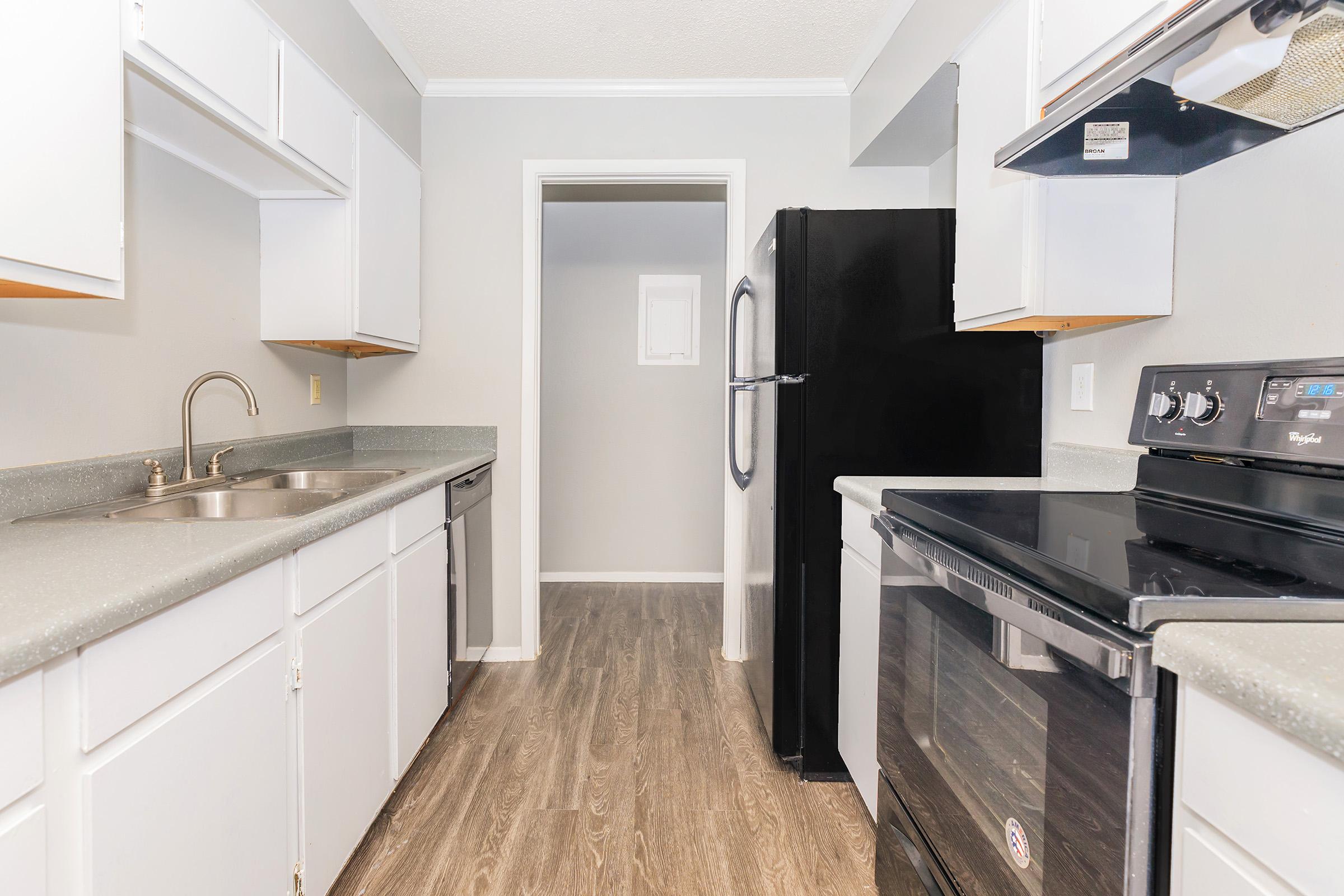 a kitchen with a stove and a sink