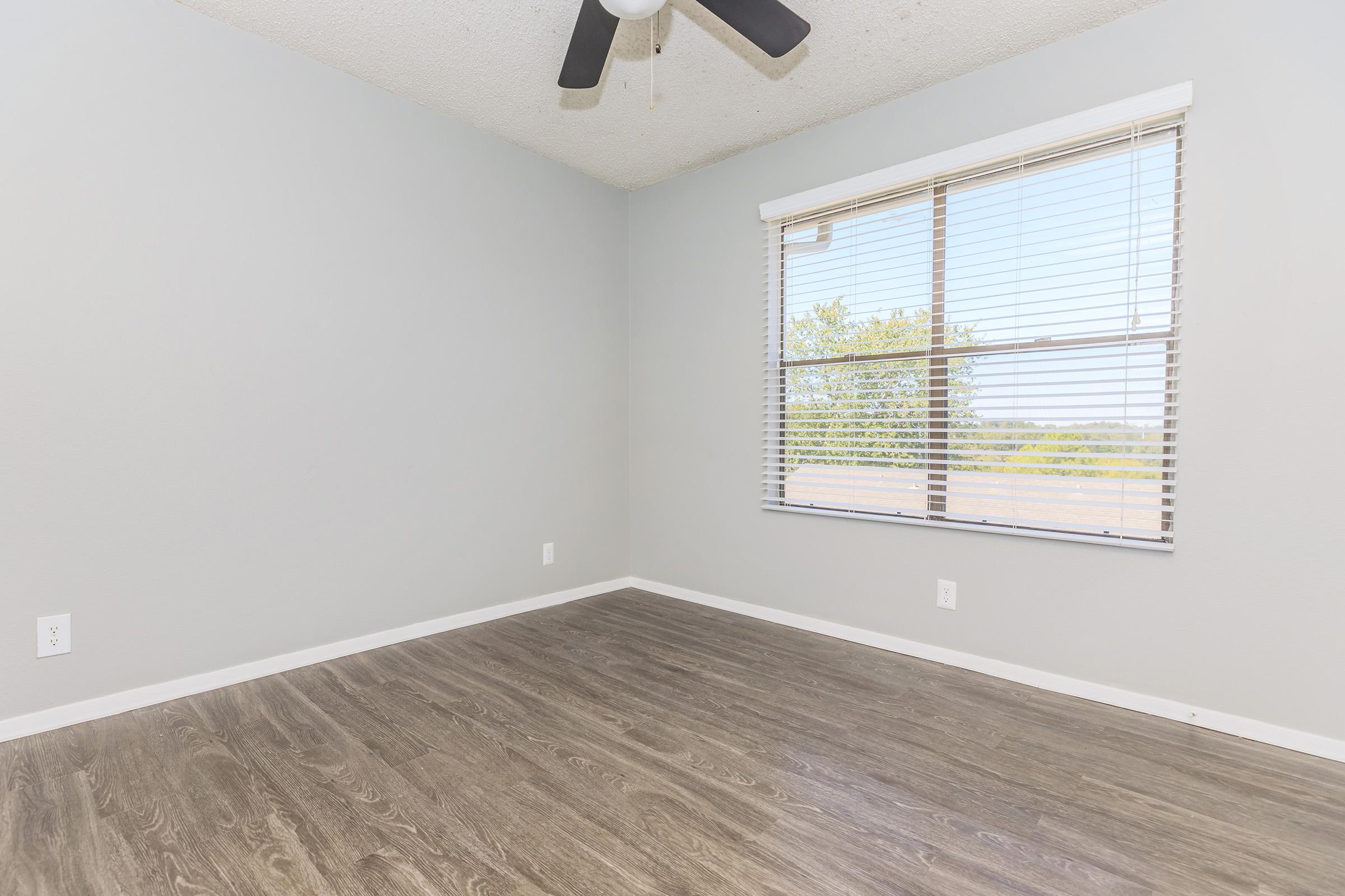 a bedroom with a large window