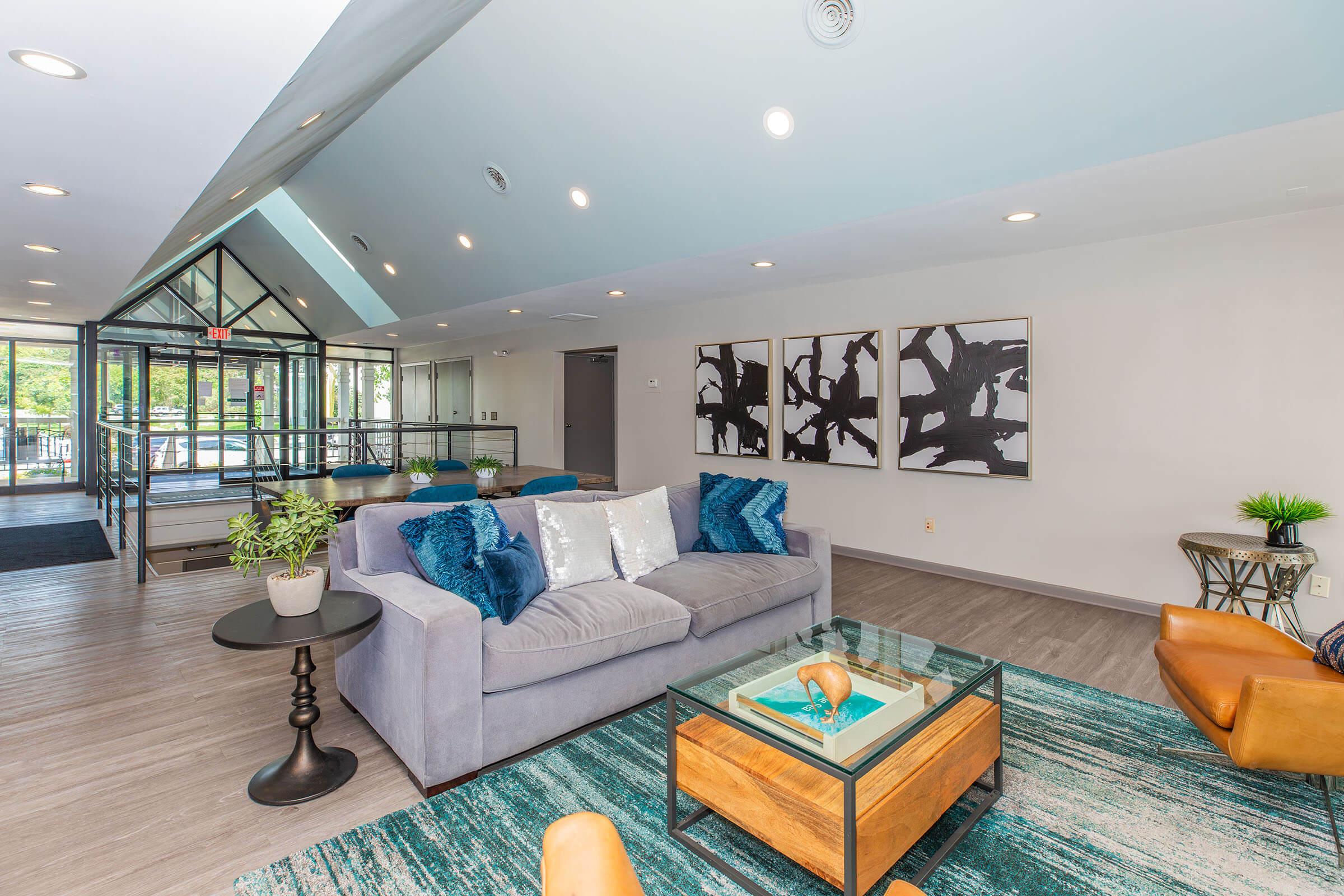 a living room filled with furniture and a flat screen tv