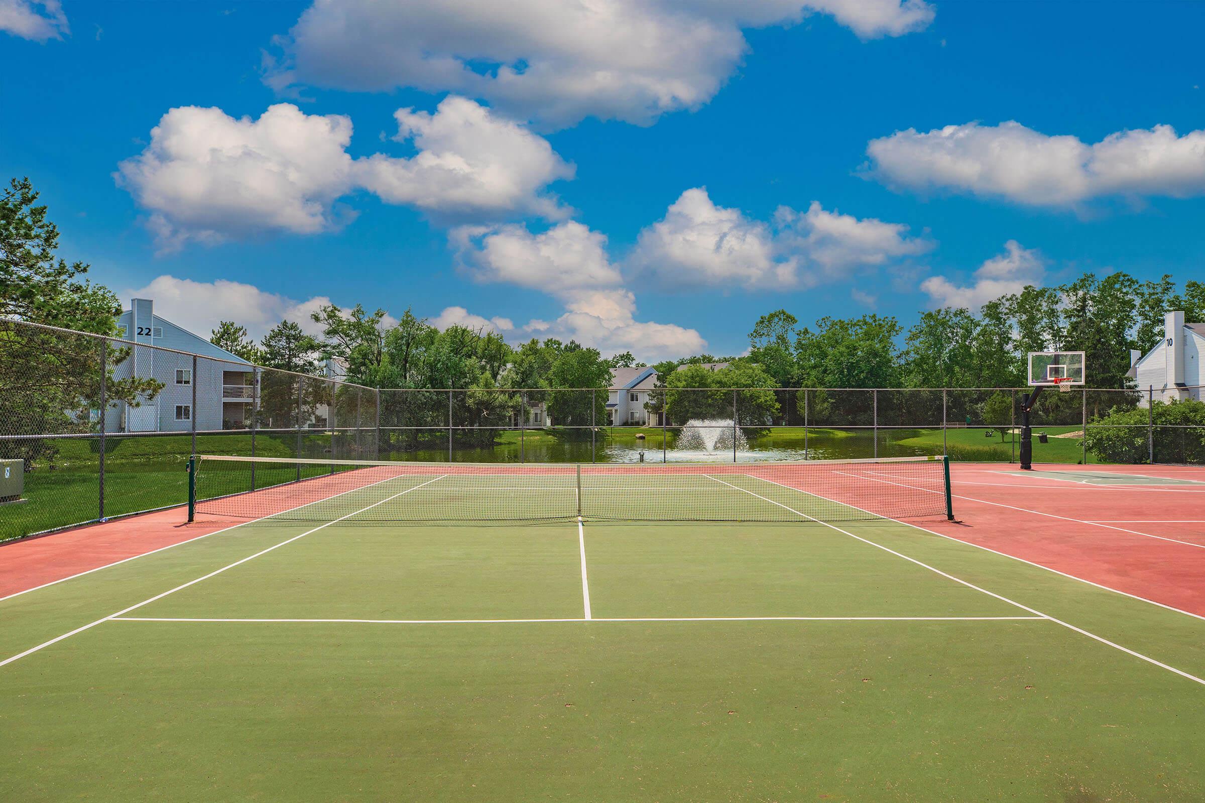 a basketball on a court with a racket