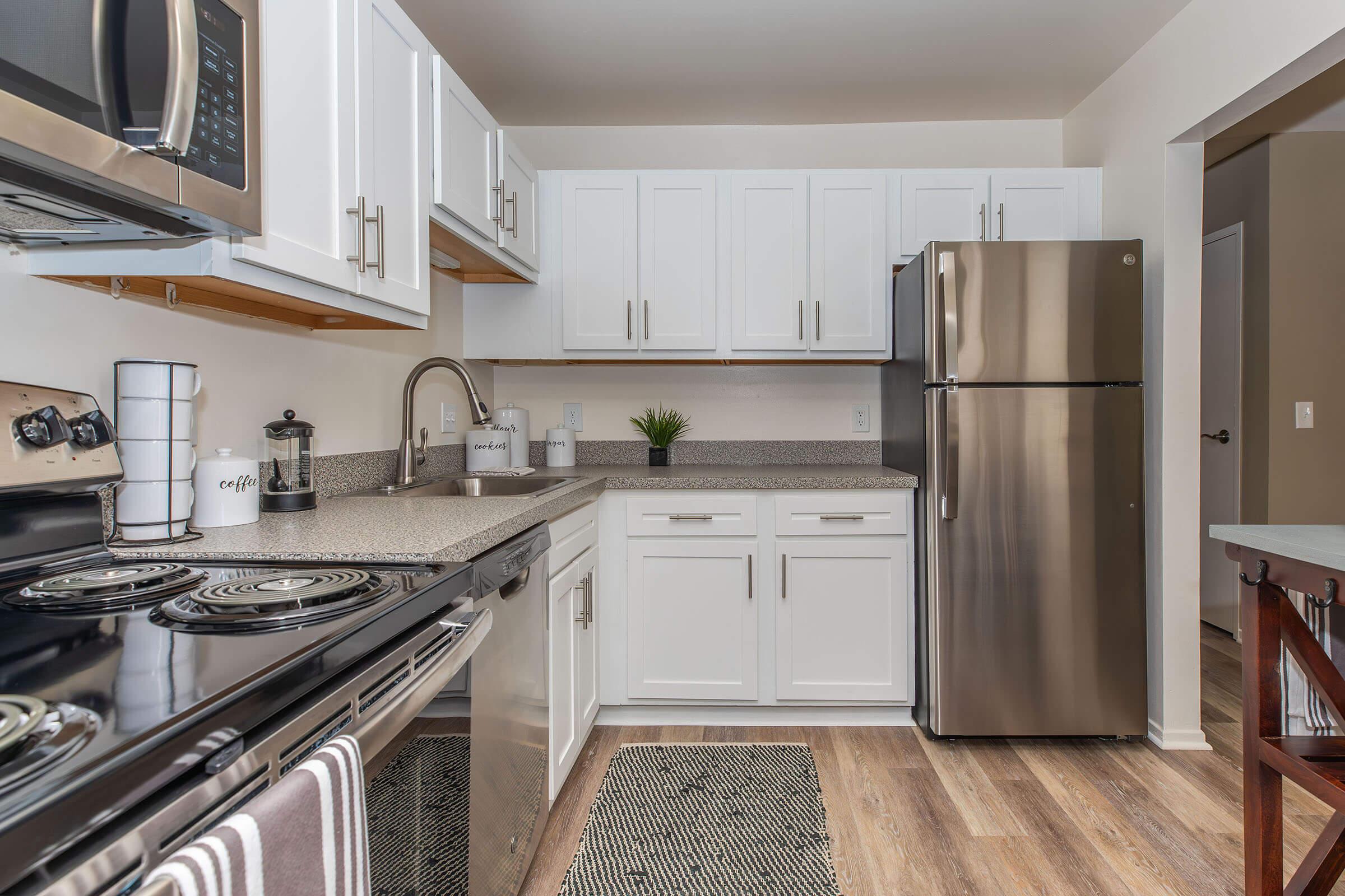 a large kitchen with stainless steel appliances