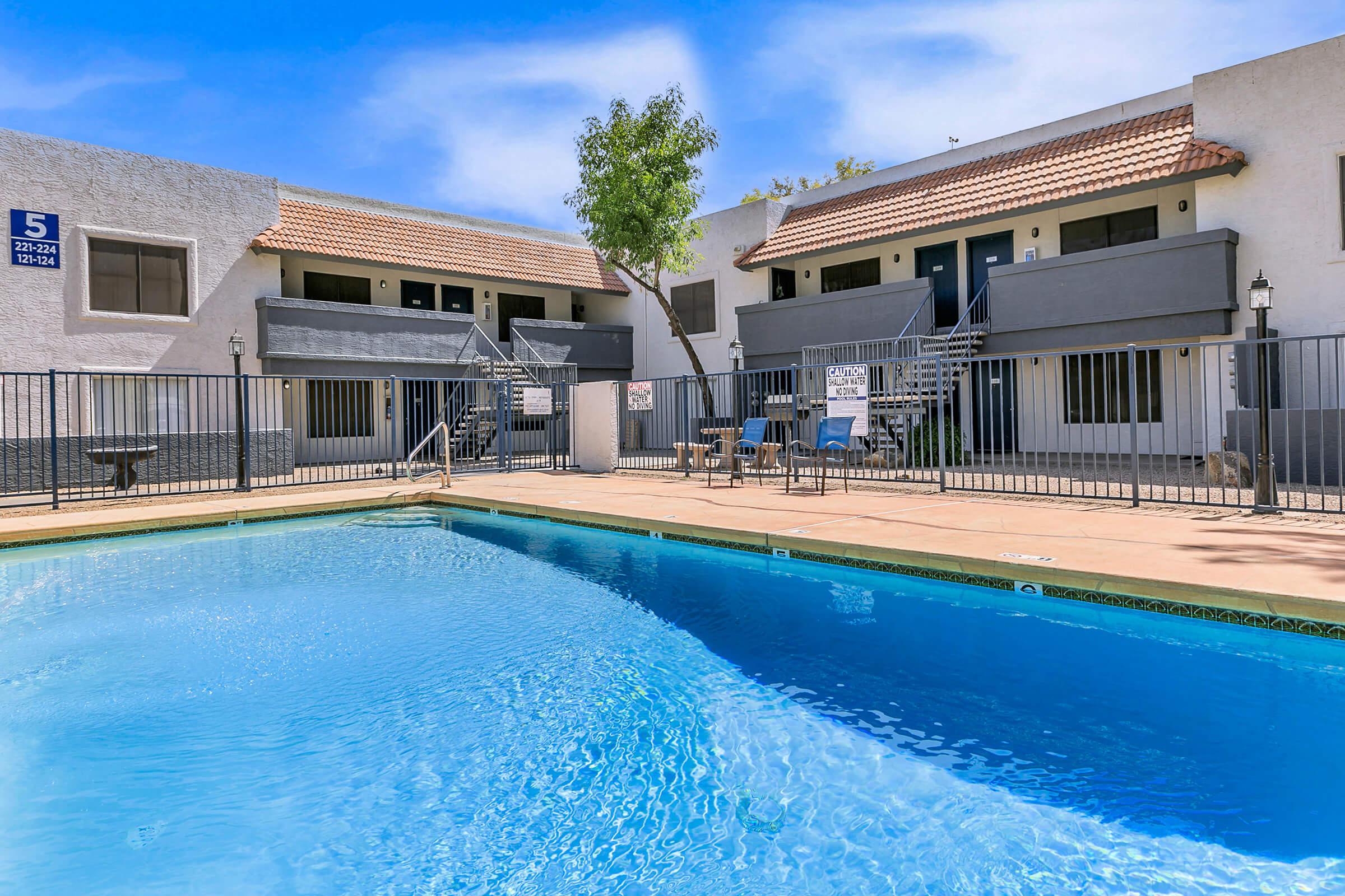 The pool area at Rise Trailside surrounded by the apartments. 