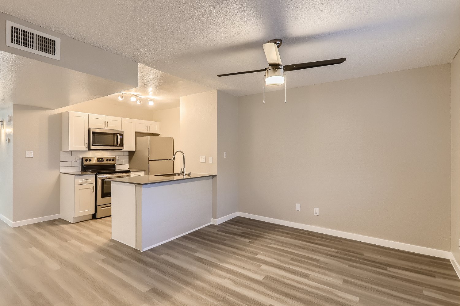 a kitchen with a wood floor