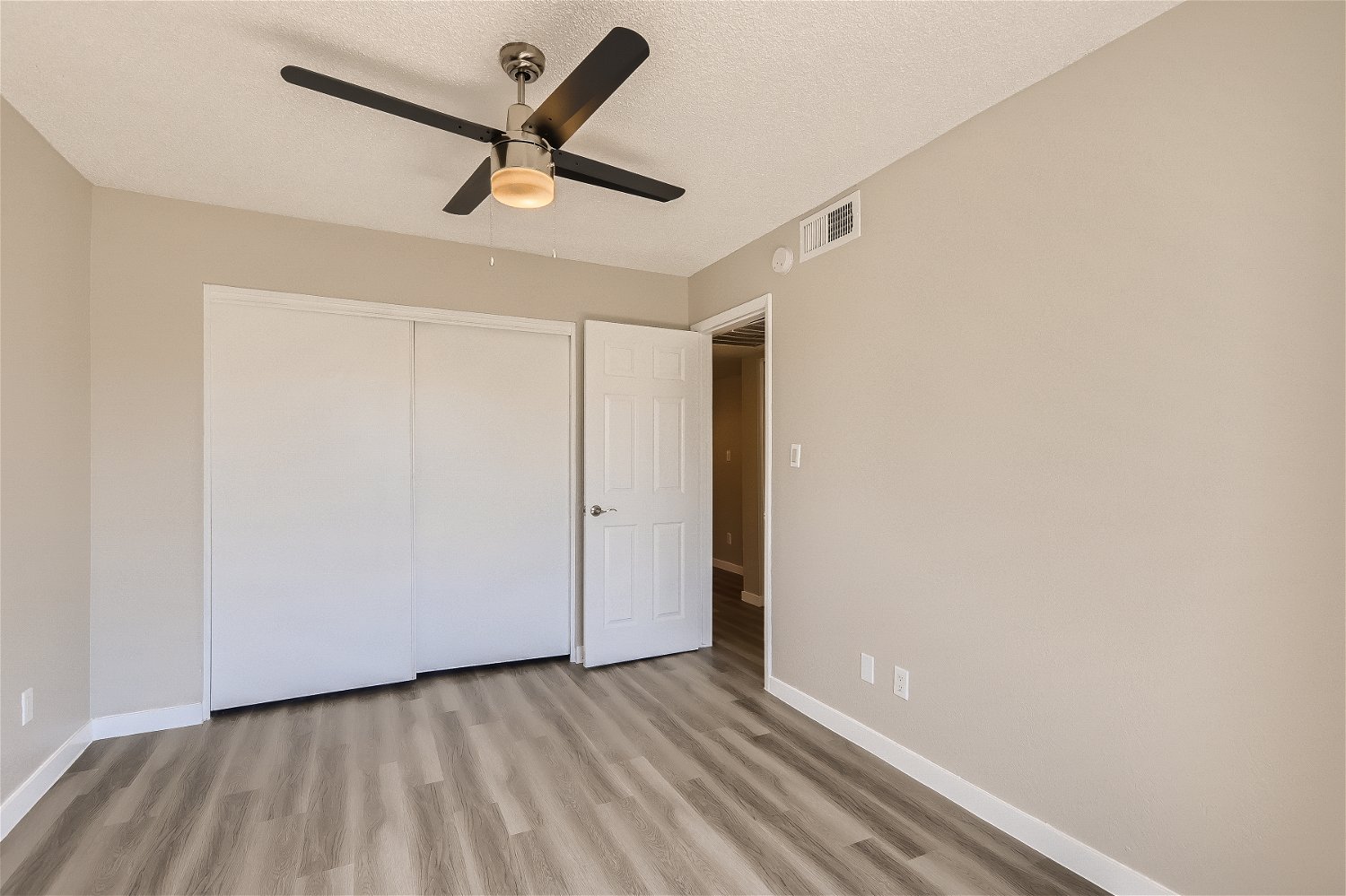 a kitchen with a wood floor