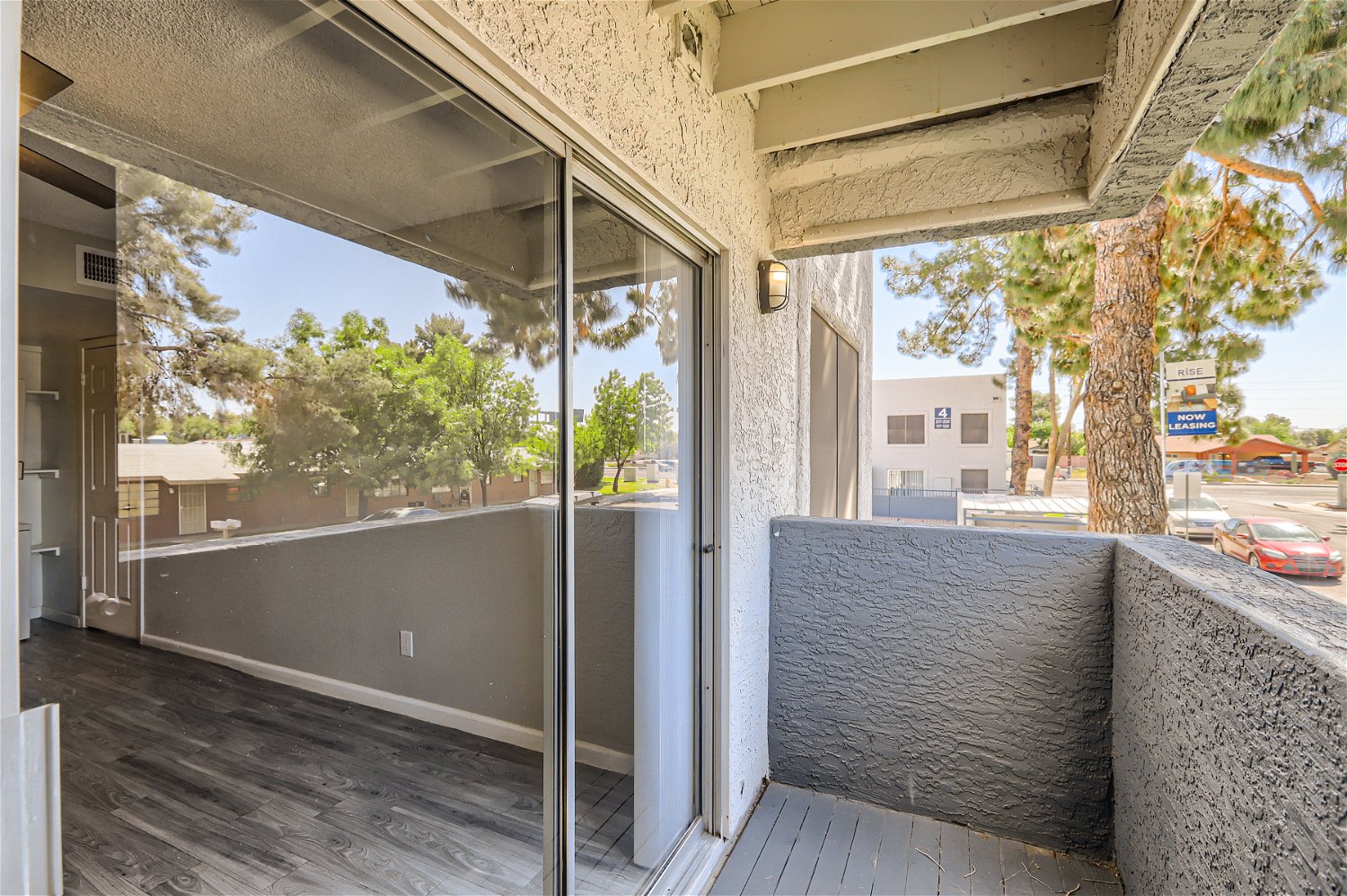 A balcony that looks into the living room at Rise Trailside. 