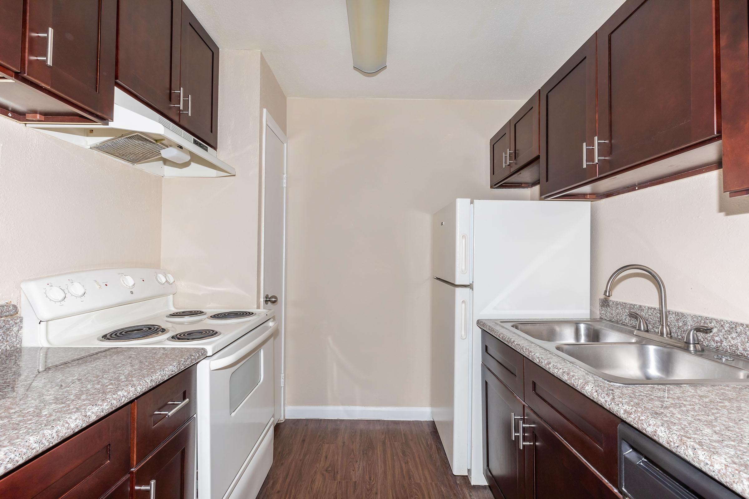 a kitchen with a stove and a sink